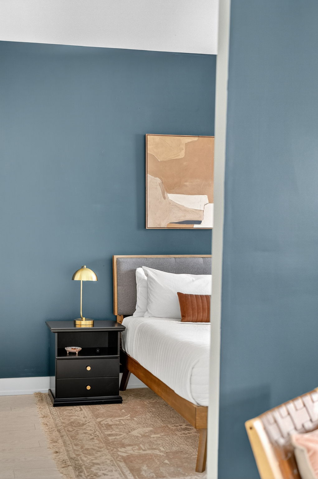 Sleep in style with a crisp, modern bedroom setup—featuring rich textures, ambient lighting, and a calming color palette.