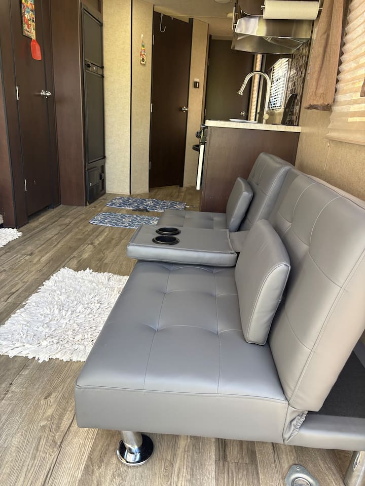Living area - couch turns into full size bed.
