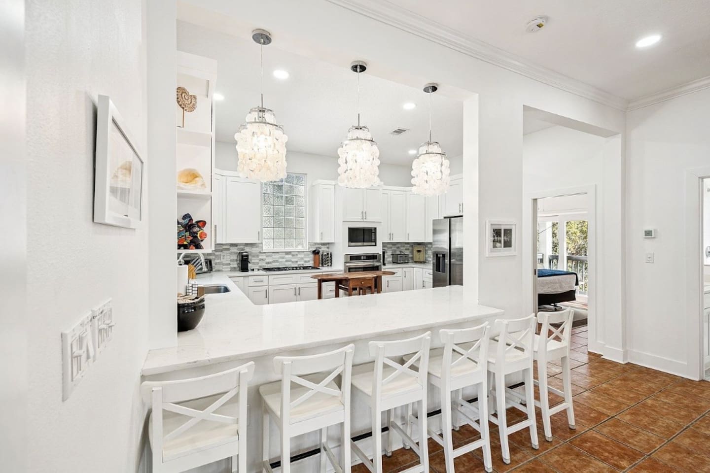Bright kitchen counter seating opening up to the main living areas.