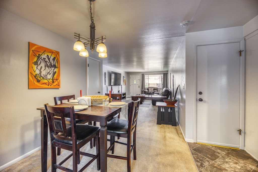 Back in the unit via sunroom.  This suite is large enough for you, family and friends!  You will also love the natural lighting from the large windows.