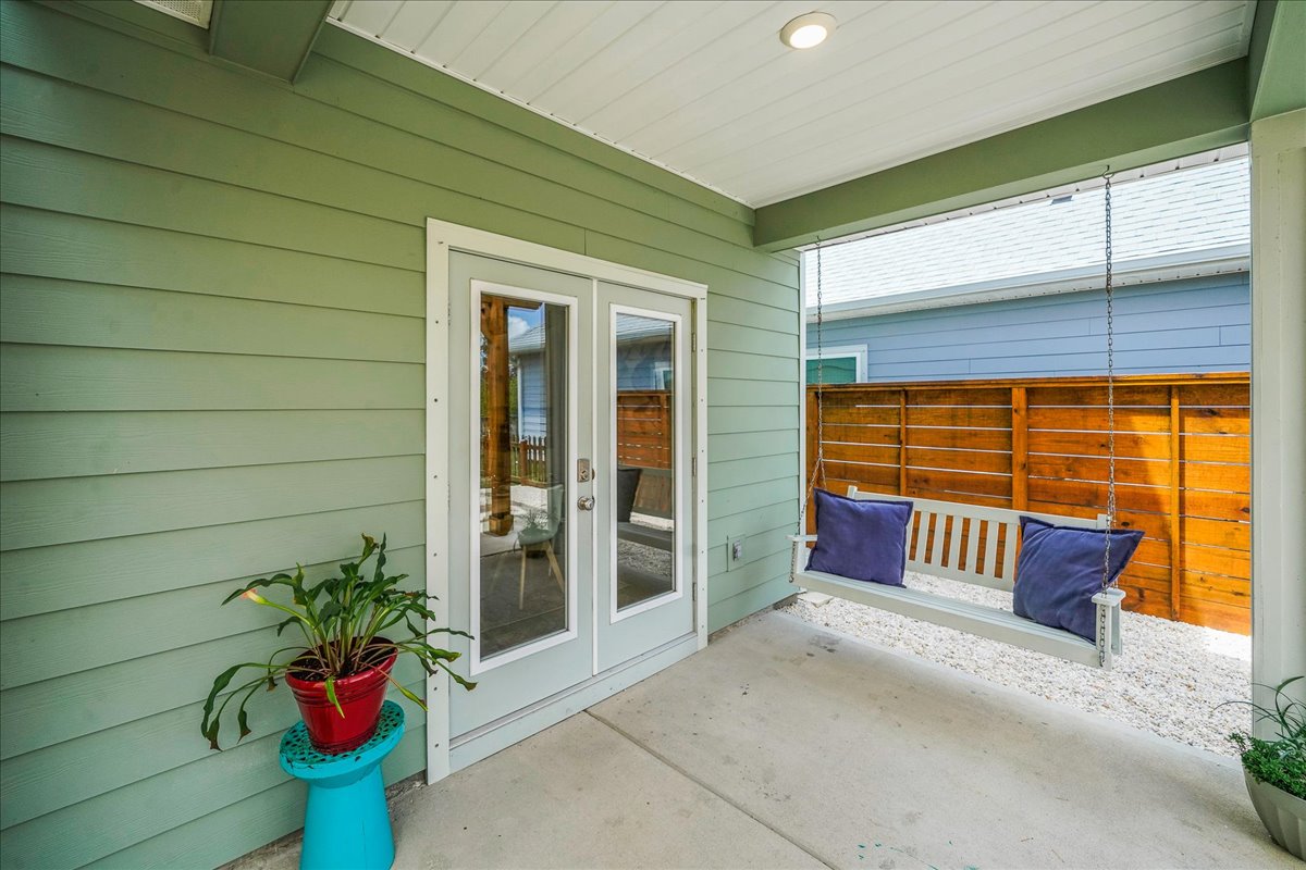Backyard access right through the door, leading to a swing set perfect for outdoor fun