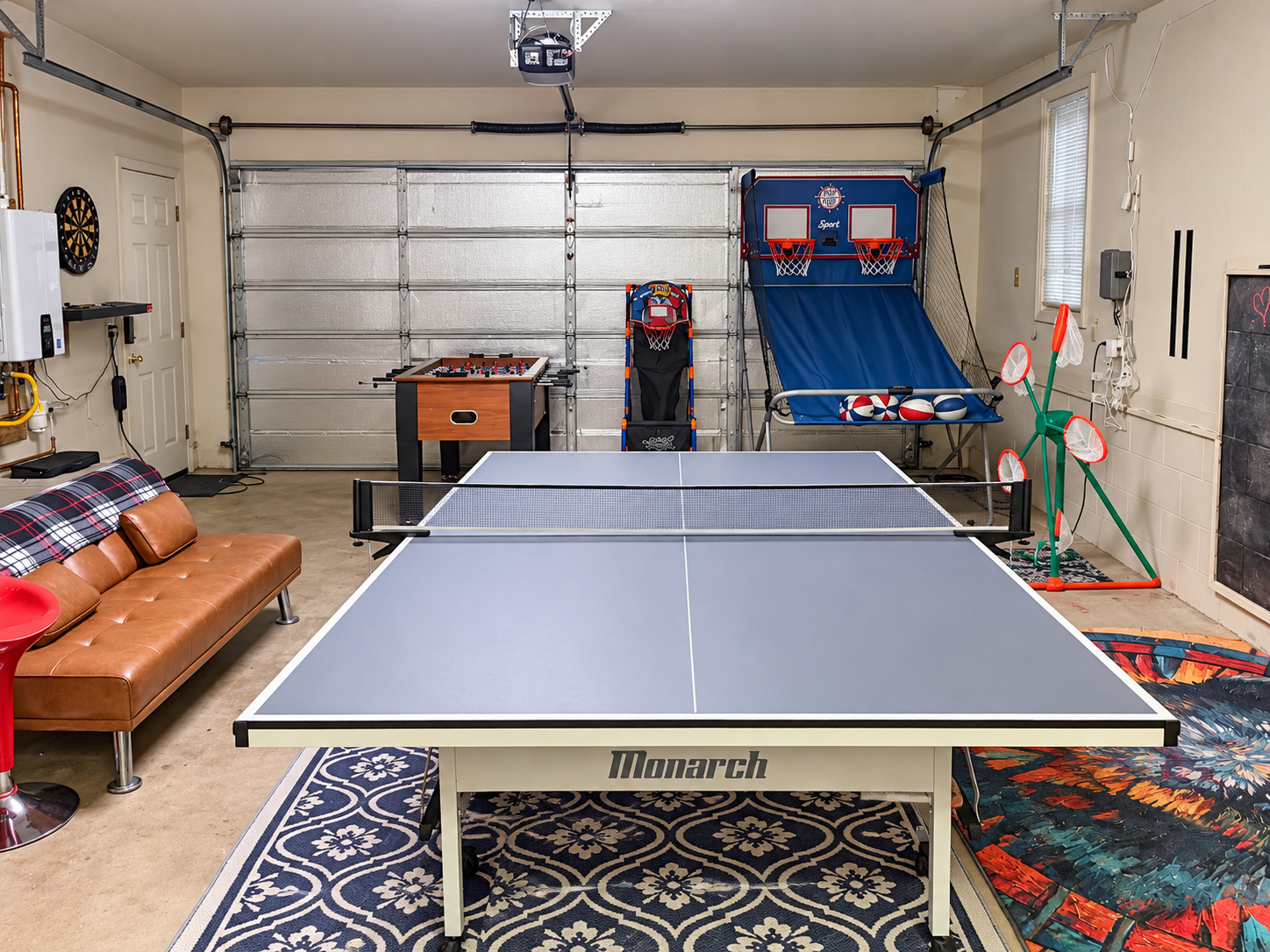 Game room with ping pong, foosball, arcade games, TV, and plenty of space for group fun.