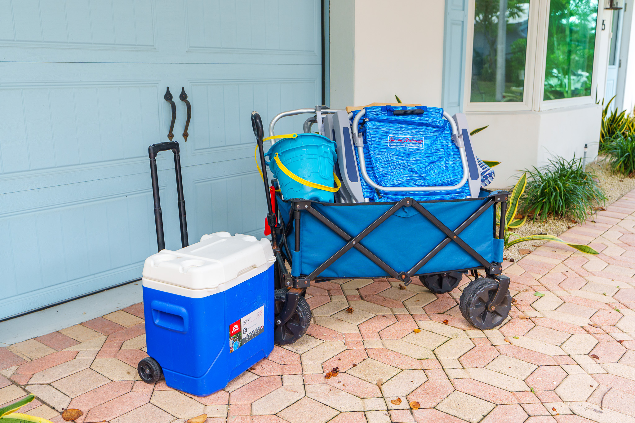 Beach chairs, beach umbrella, wagon, beach bag, and cooler