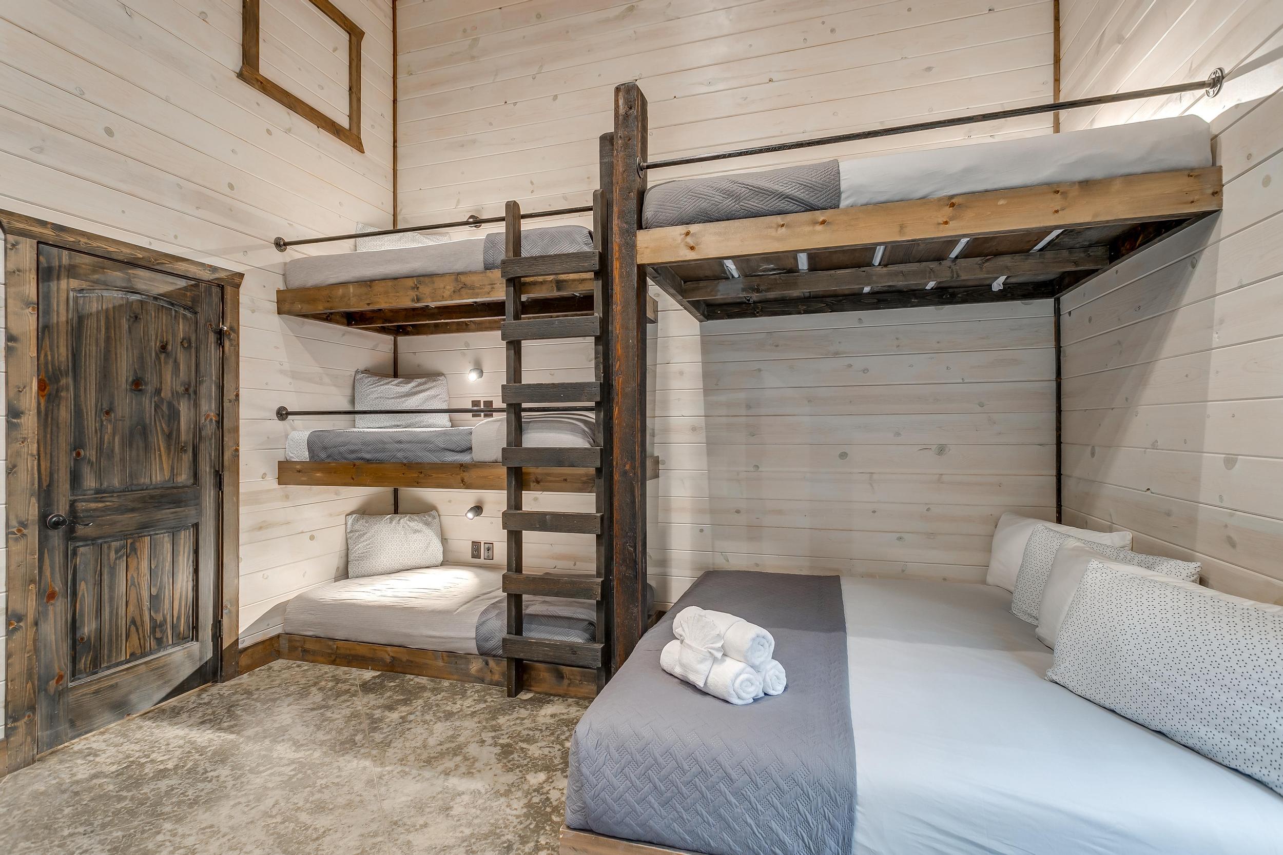 Right side: King (lower), Queen (upper).   Left side: triple stack of twin beds