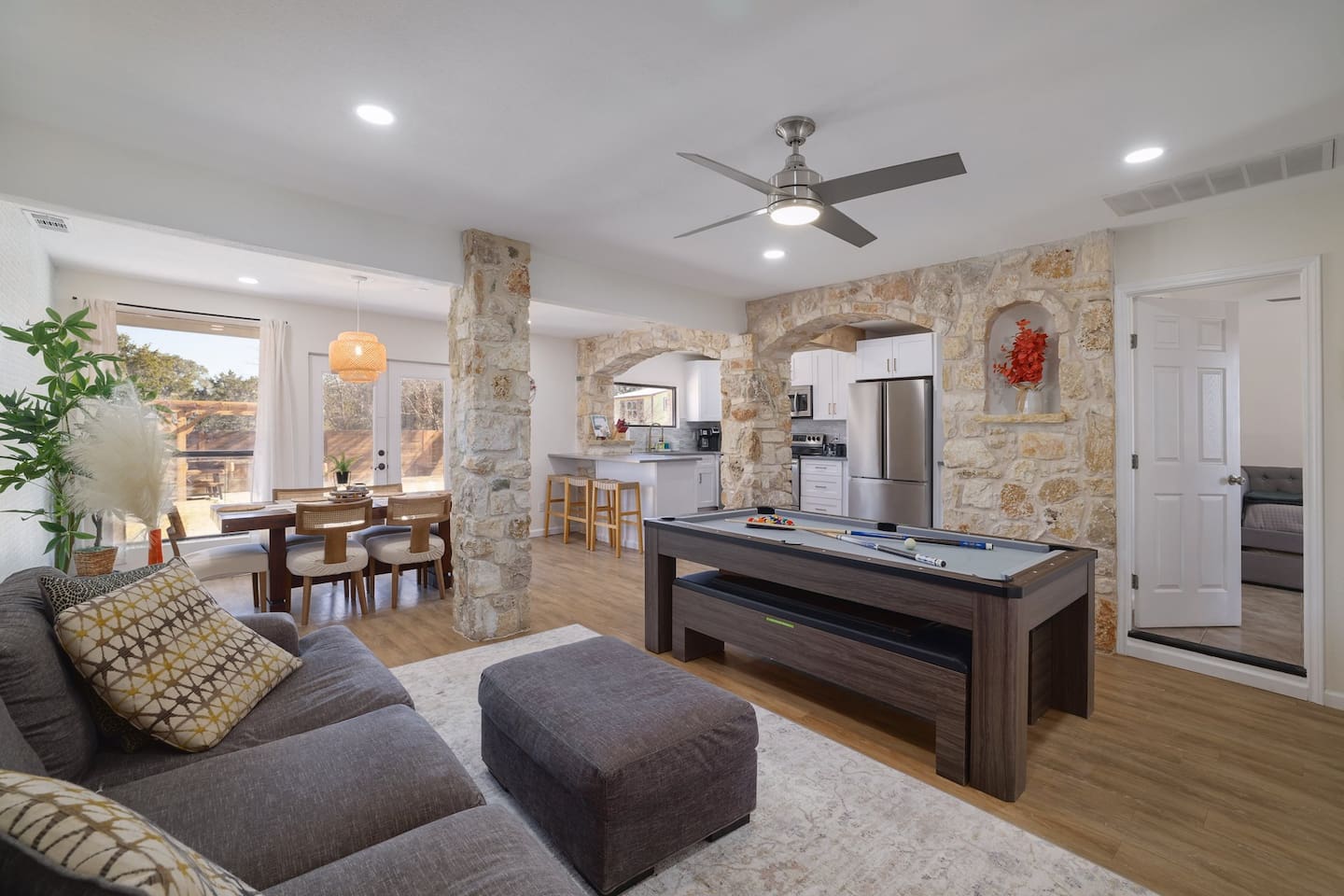 Gather, play, and unwind in a space designed for effortless connection. From friendly pool games to shared meals beside warm stone accents, every corner invites guests to slow down and feel at home.