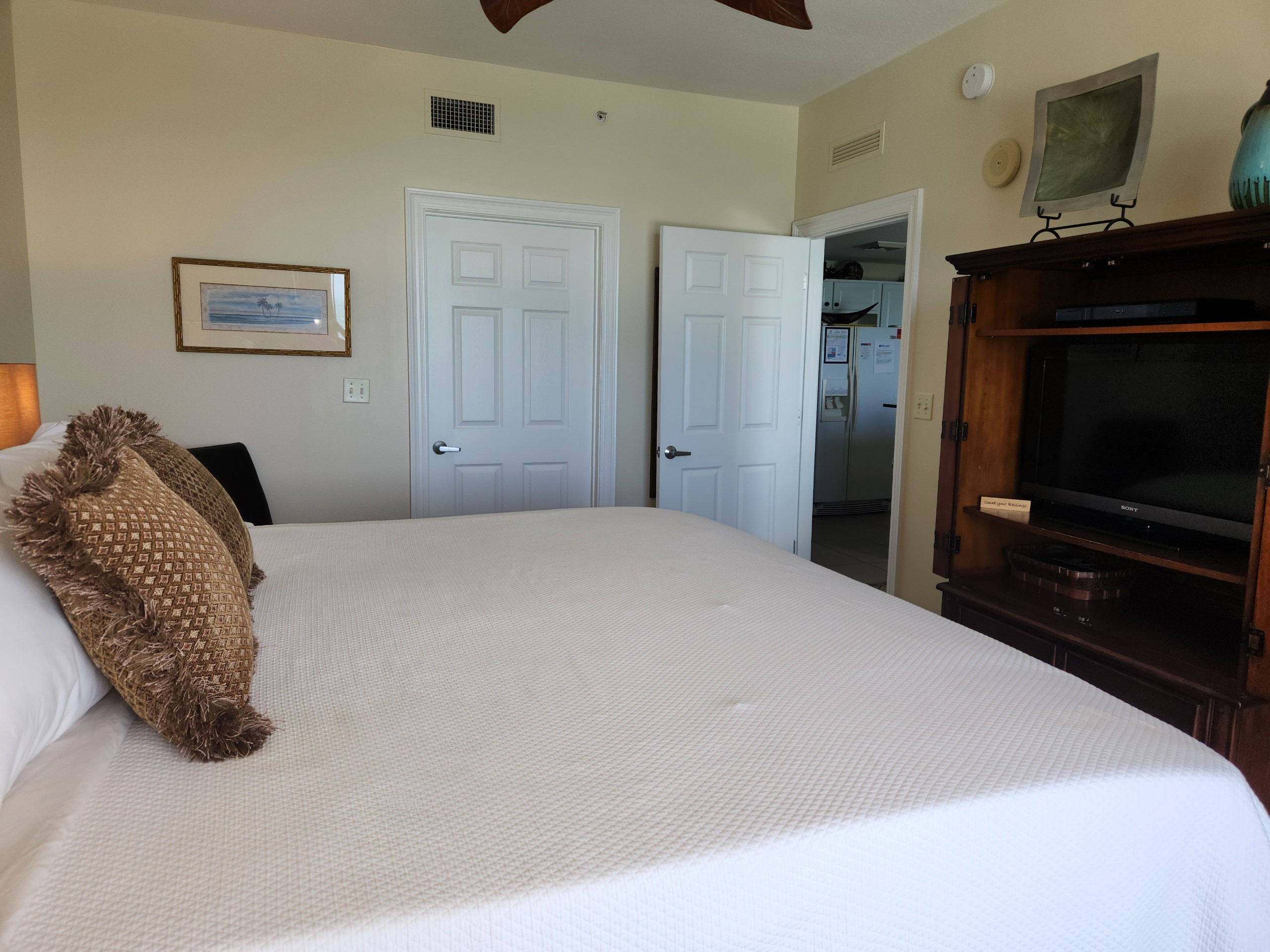 The master bedroom also has direct balcony access and a private, flat screen tv