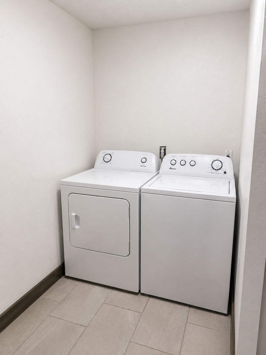 Laundry  area inside of bathroom 