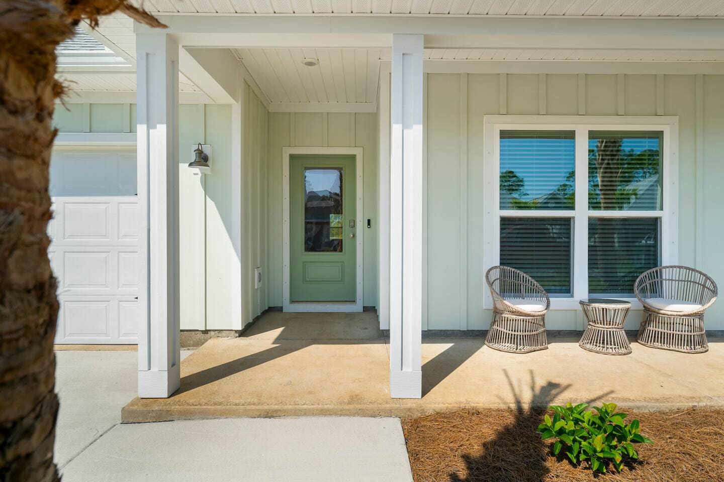 Welcoming front yard with a balcony perfect for morning coffee.