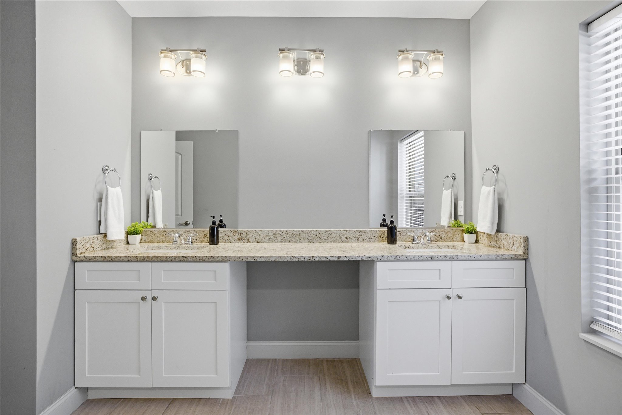 Start your morning here—plenty of counter space, double sinks, and room for everyone to get ready without bumping elbows. Spread out your things, take your time, and ease into the day.