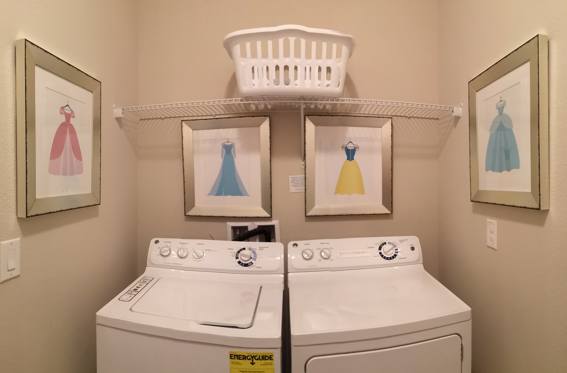 Laundry room: washer, dryer, laundry basket, iron, ironing board