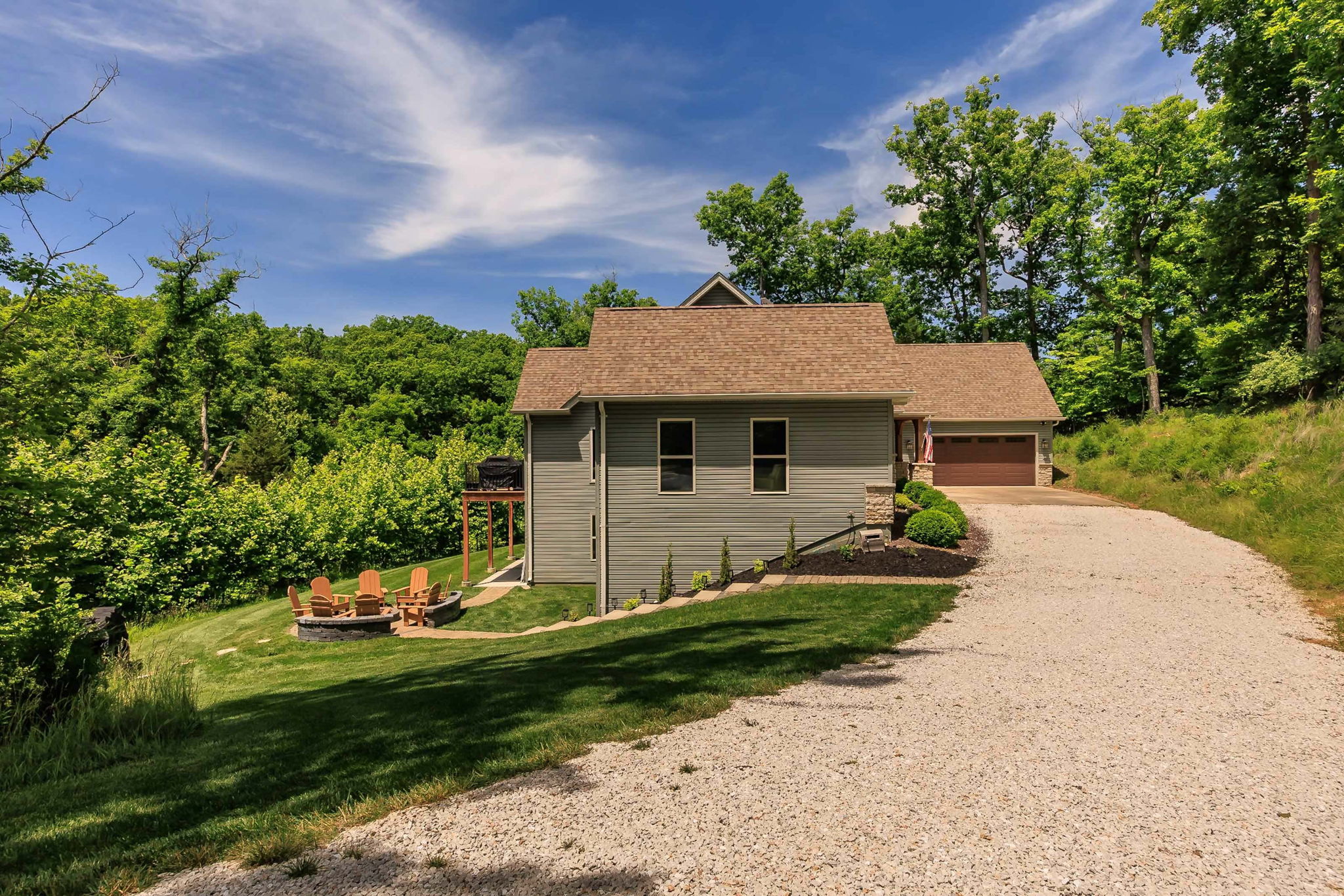 Long driveway provides ample parking for multiple vehicles.