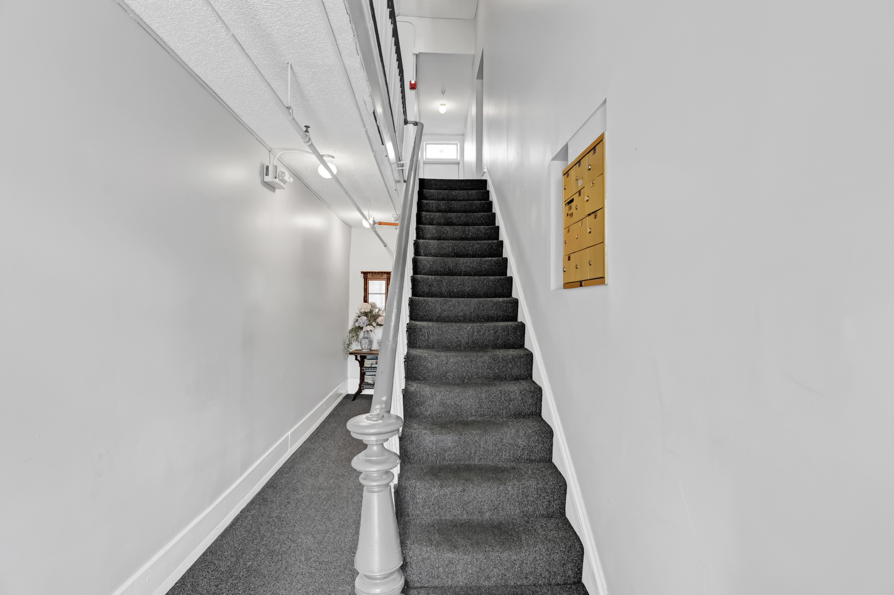 Charming staircase leads you up to your private second-floor retreat.