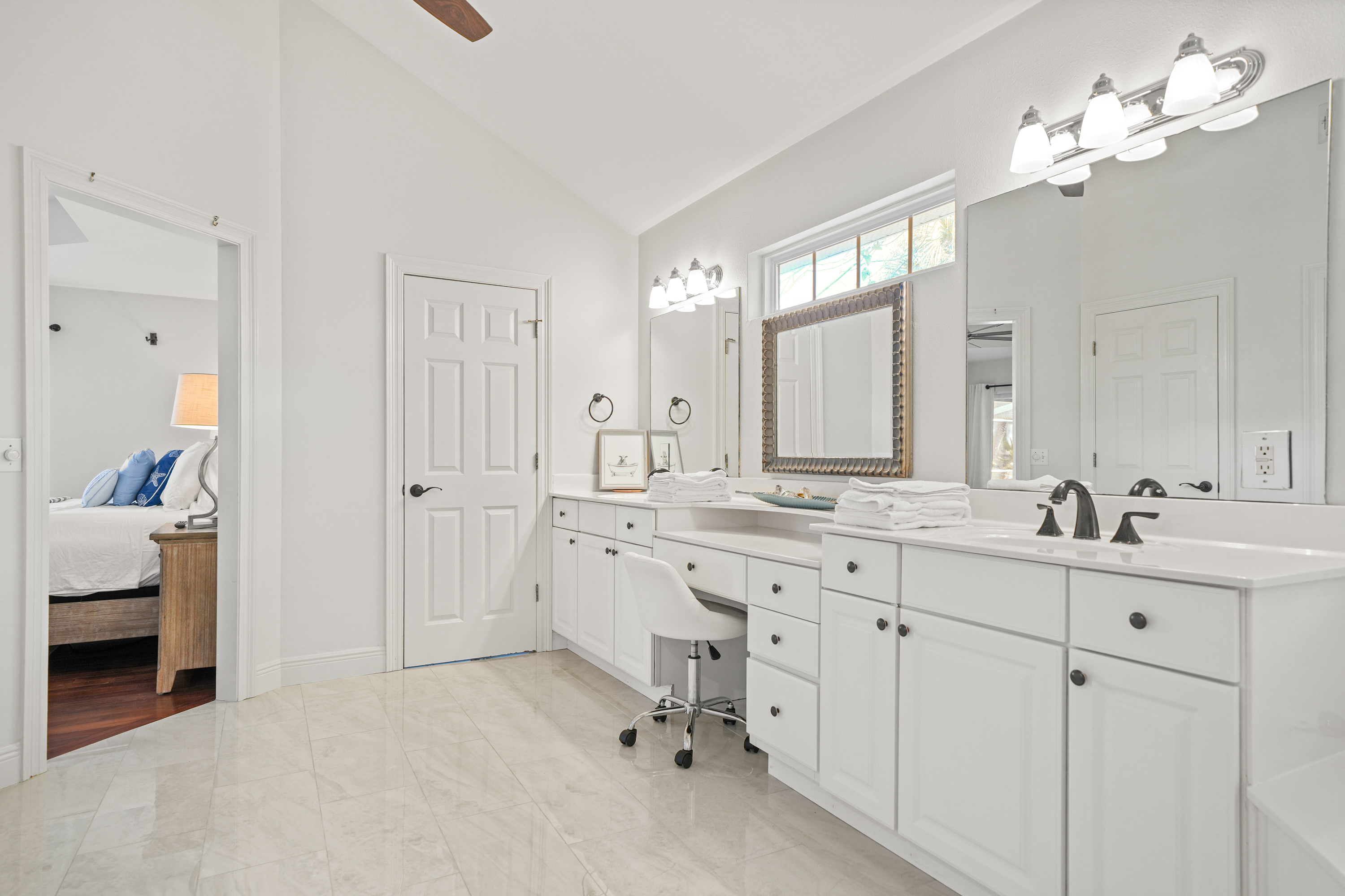 Primary Bathroom vanity and walk-in closet