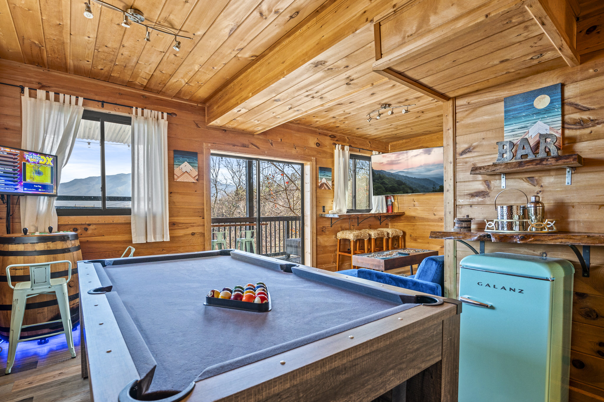 The lower level is full of fun including plenty of games, a mini-fridge, hot tub and private bedroom with full bath