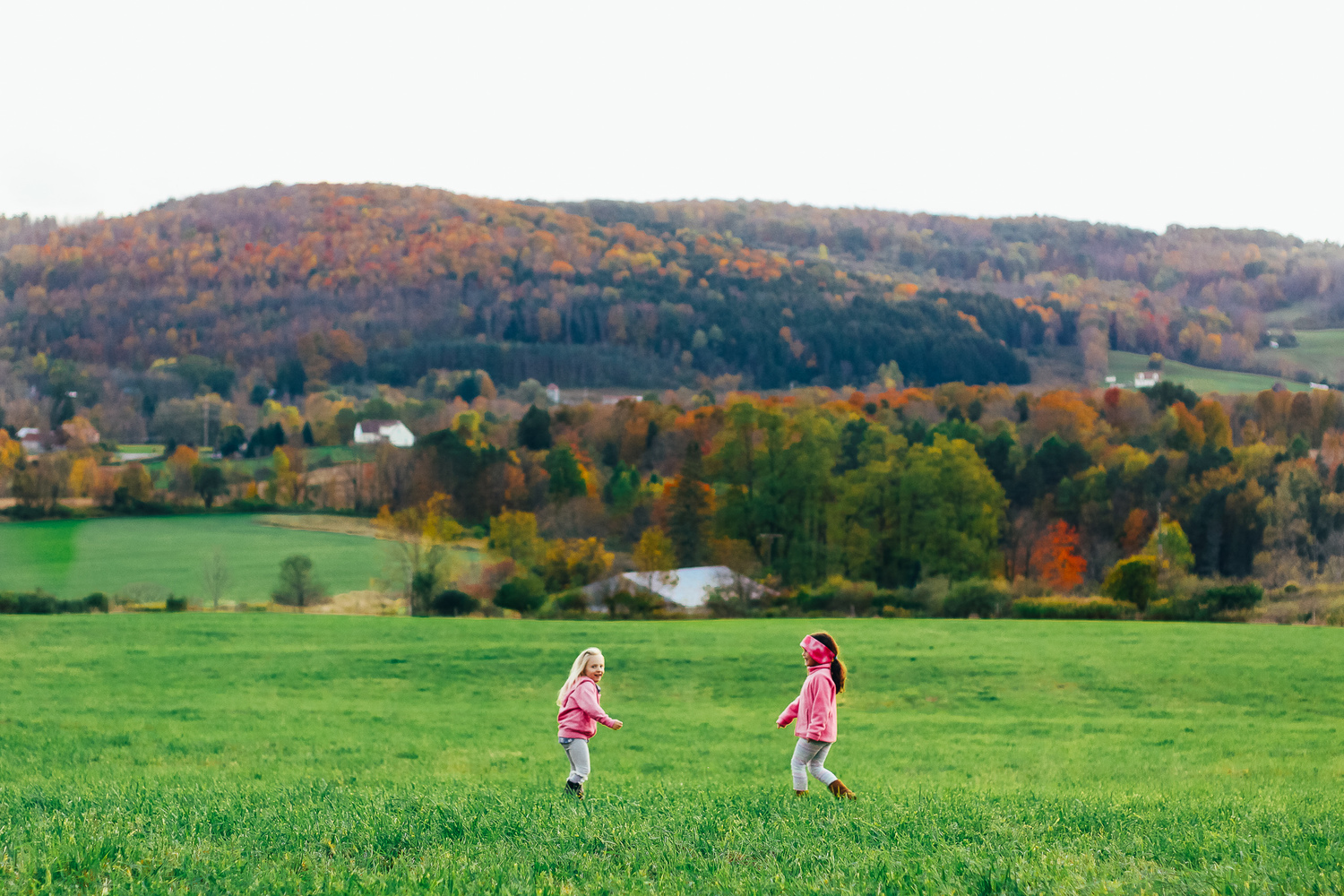 Kids playing in the large yard.