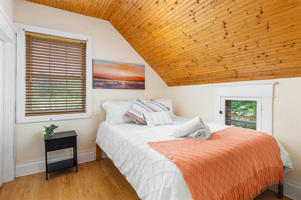 Embrace tranquility in our cozy bedroom with a plush queen-sized bed. Serenity and peaceful dreams await!