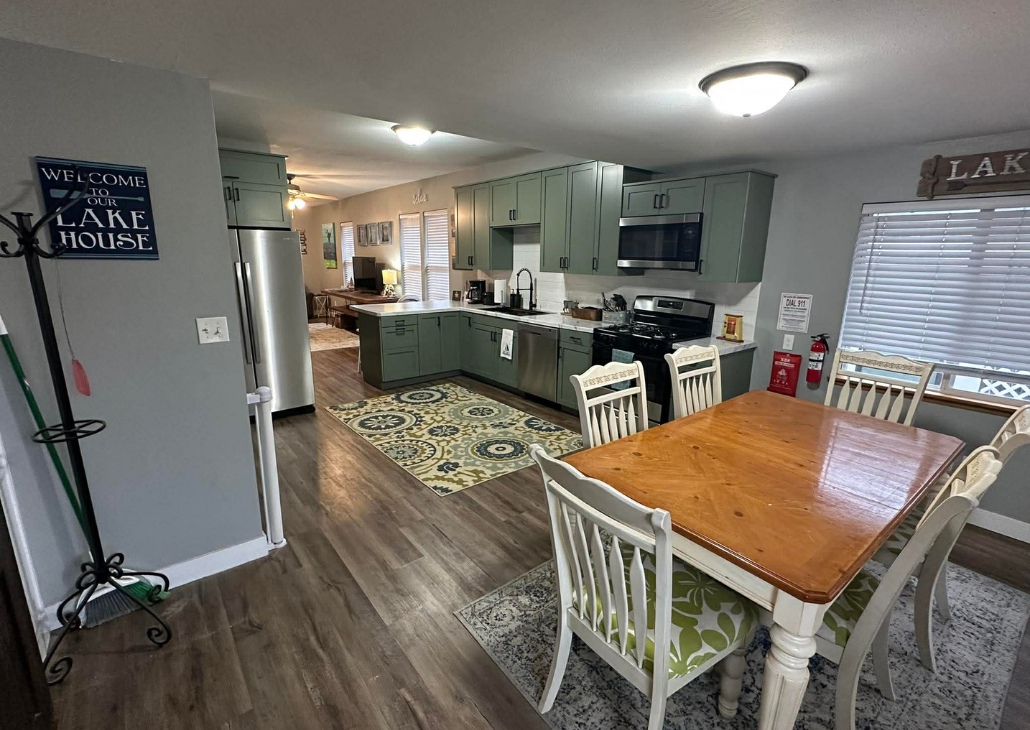 New emerald green kitchen cabinets with new countertops.