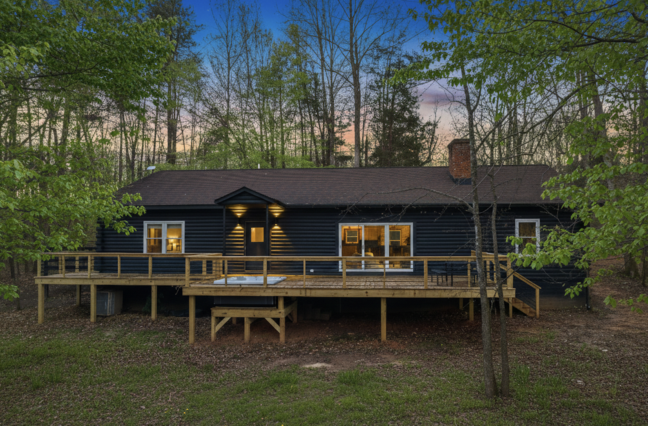 Charming Retreat: Enjoy serene forest views from the spacious deck of your private getaway!