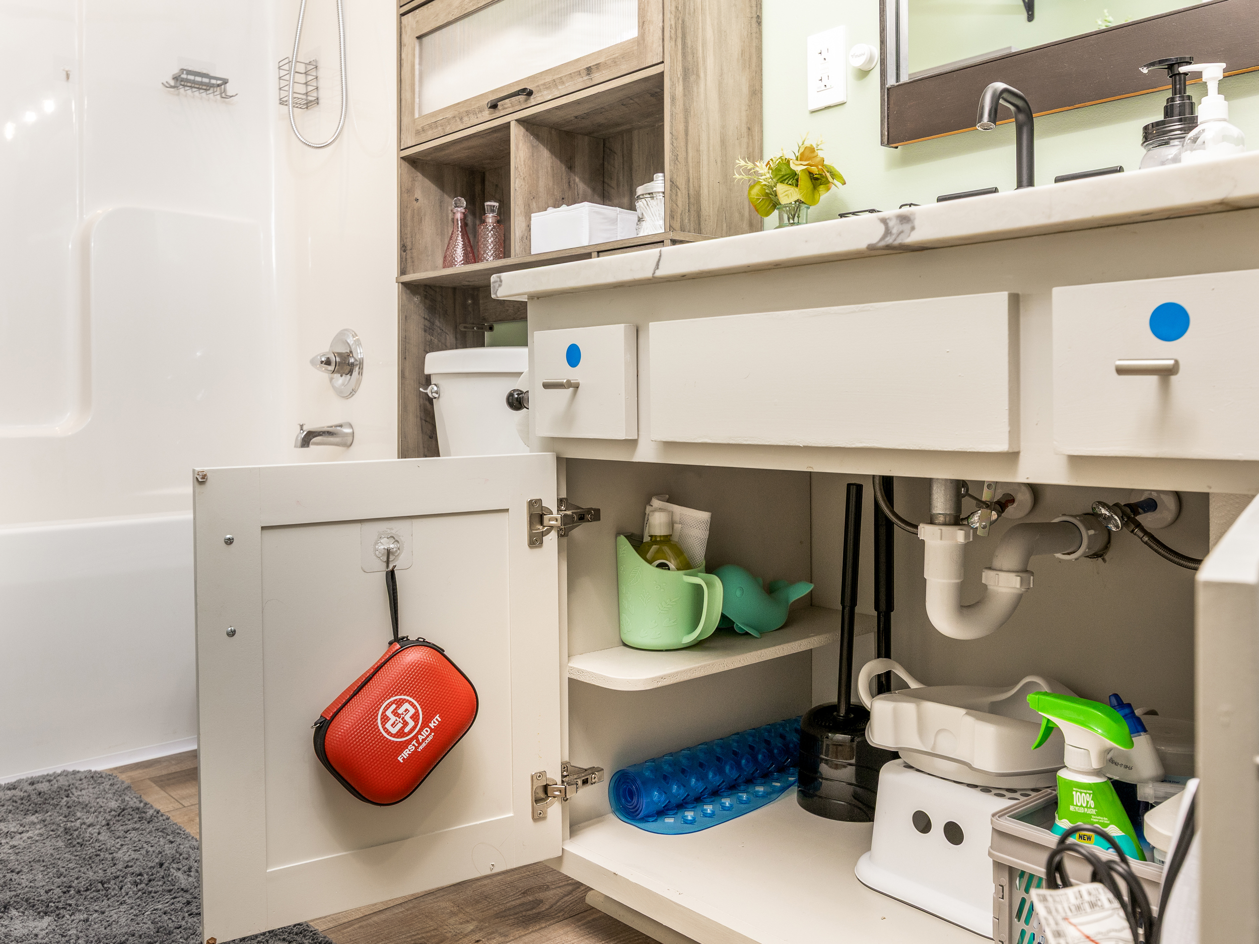 Bathrooms are stocked with practical essentials including cleaning supplies, a first aid kit, hair dryer, and baby bath accessories. Extra conveniences help guests settle in comfortably from day one.