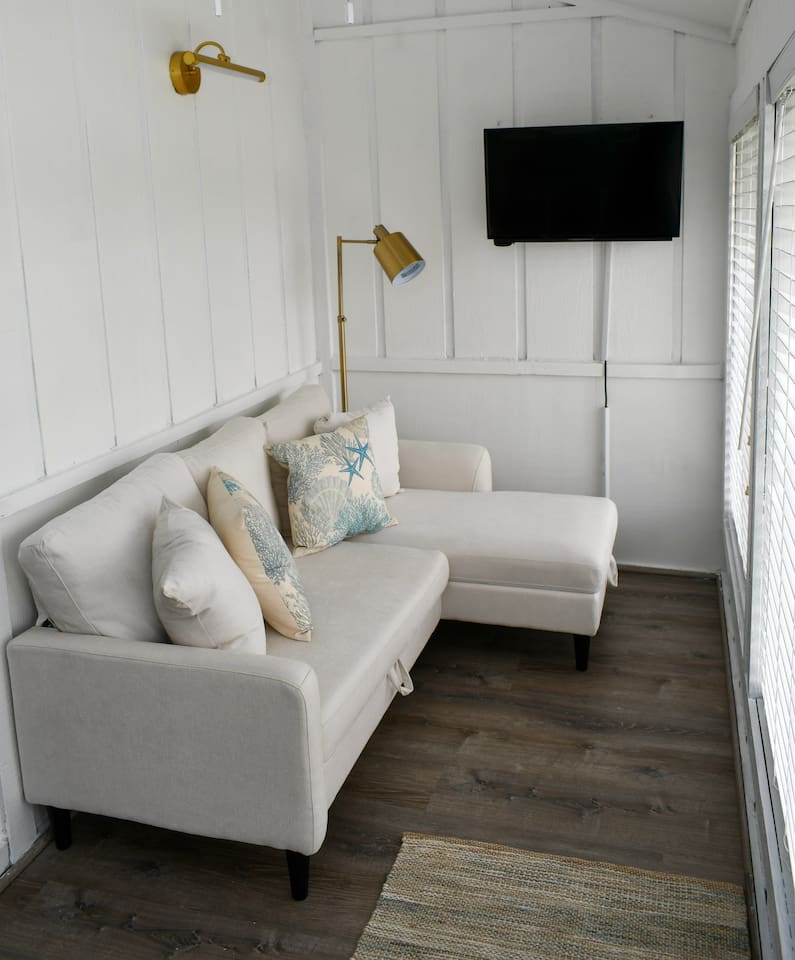 This room is an enclosed sunroom off Bedroom 1.  There is a pull out couch that turns into a full bed. Sheets and quilts can be found in the storage area under the chase of the couch. 