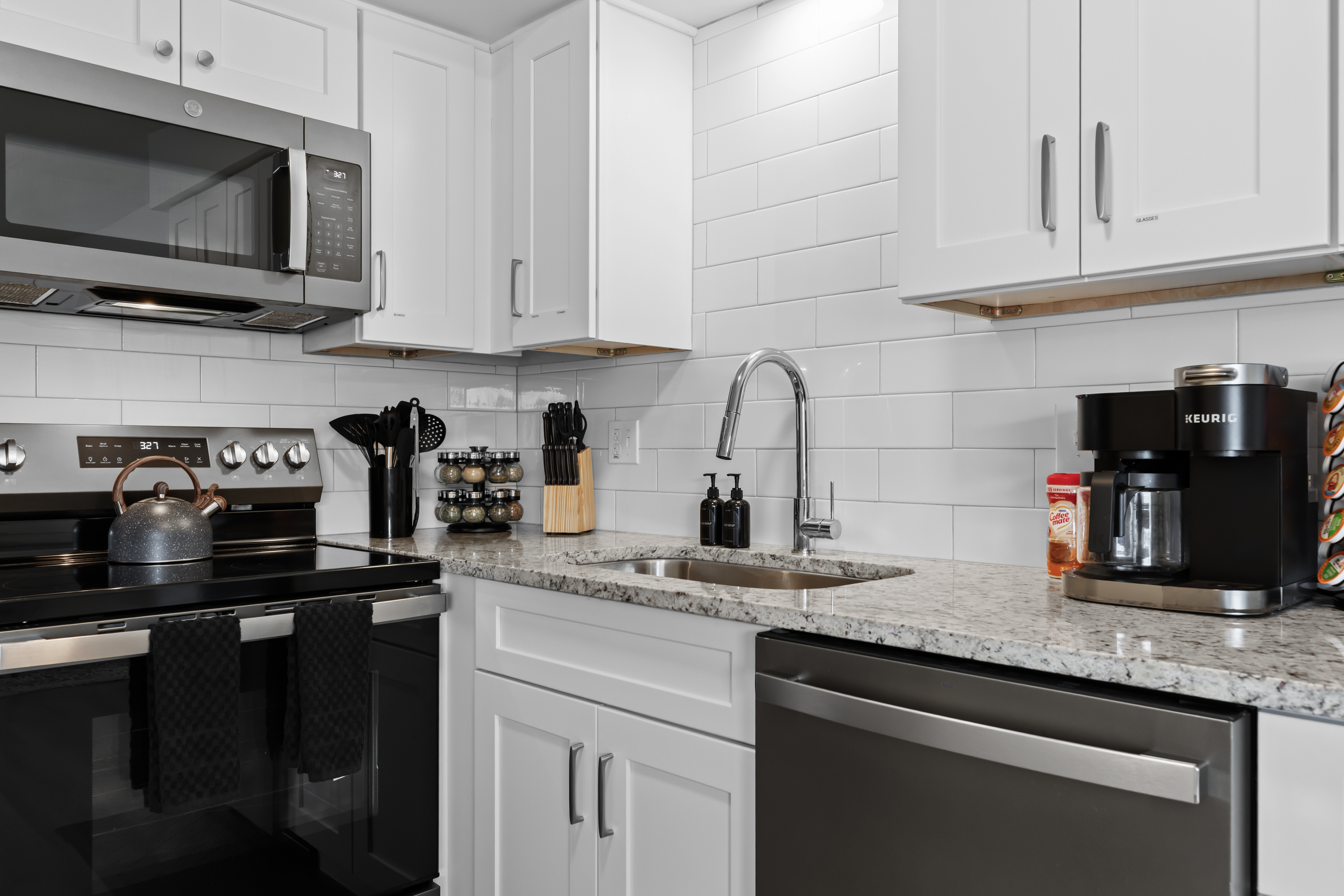 Savor the details—gleaming countertops, subway tile backsplash, and premium appliances for all your cooking needs.