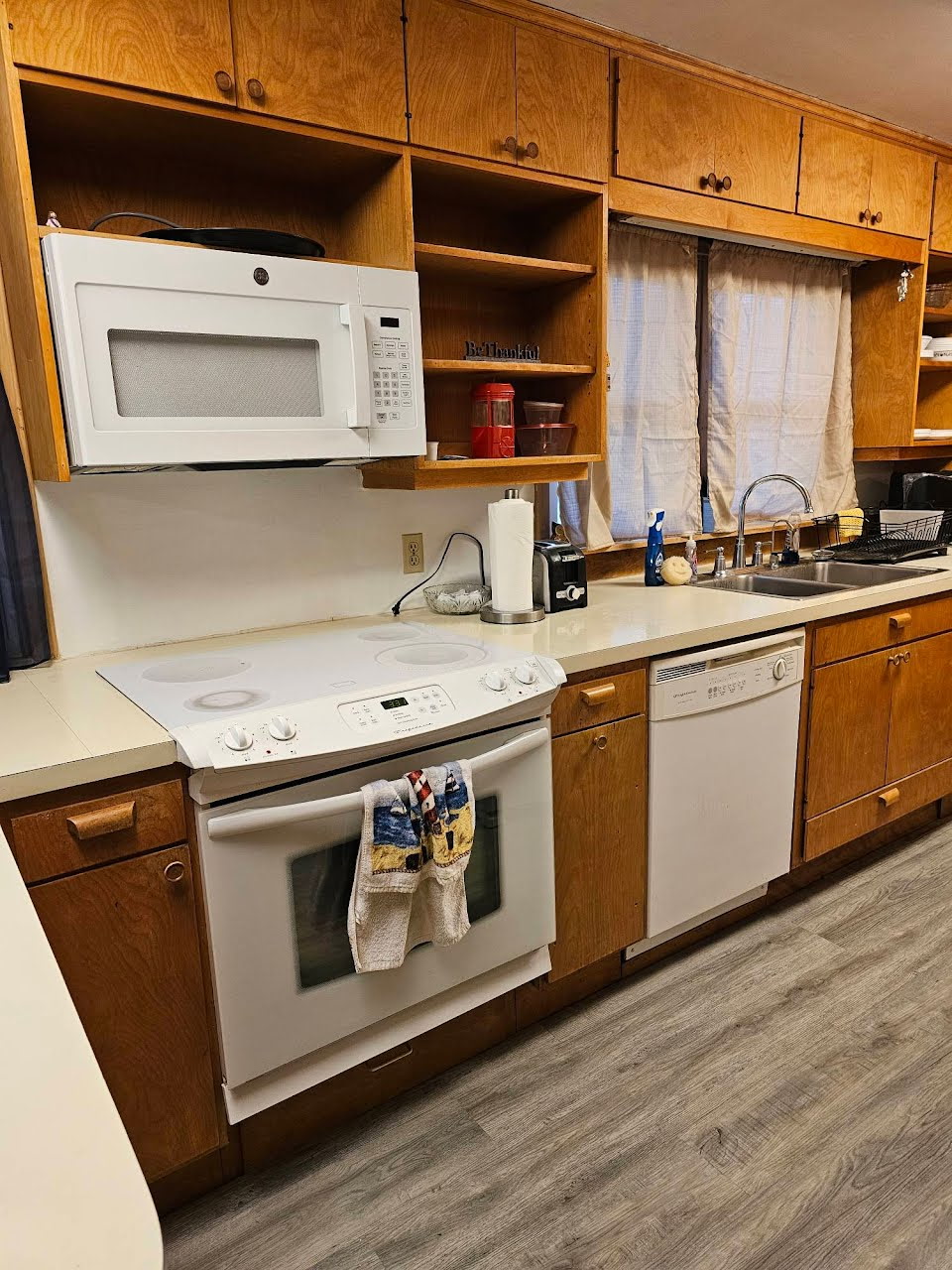 Full kitchen with stove, oven, microwave, refrigerator, and dishwasher. Plates, cups, silverware, pots, pans, and most essentials.