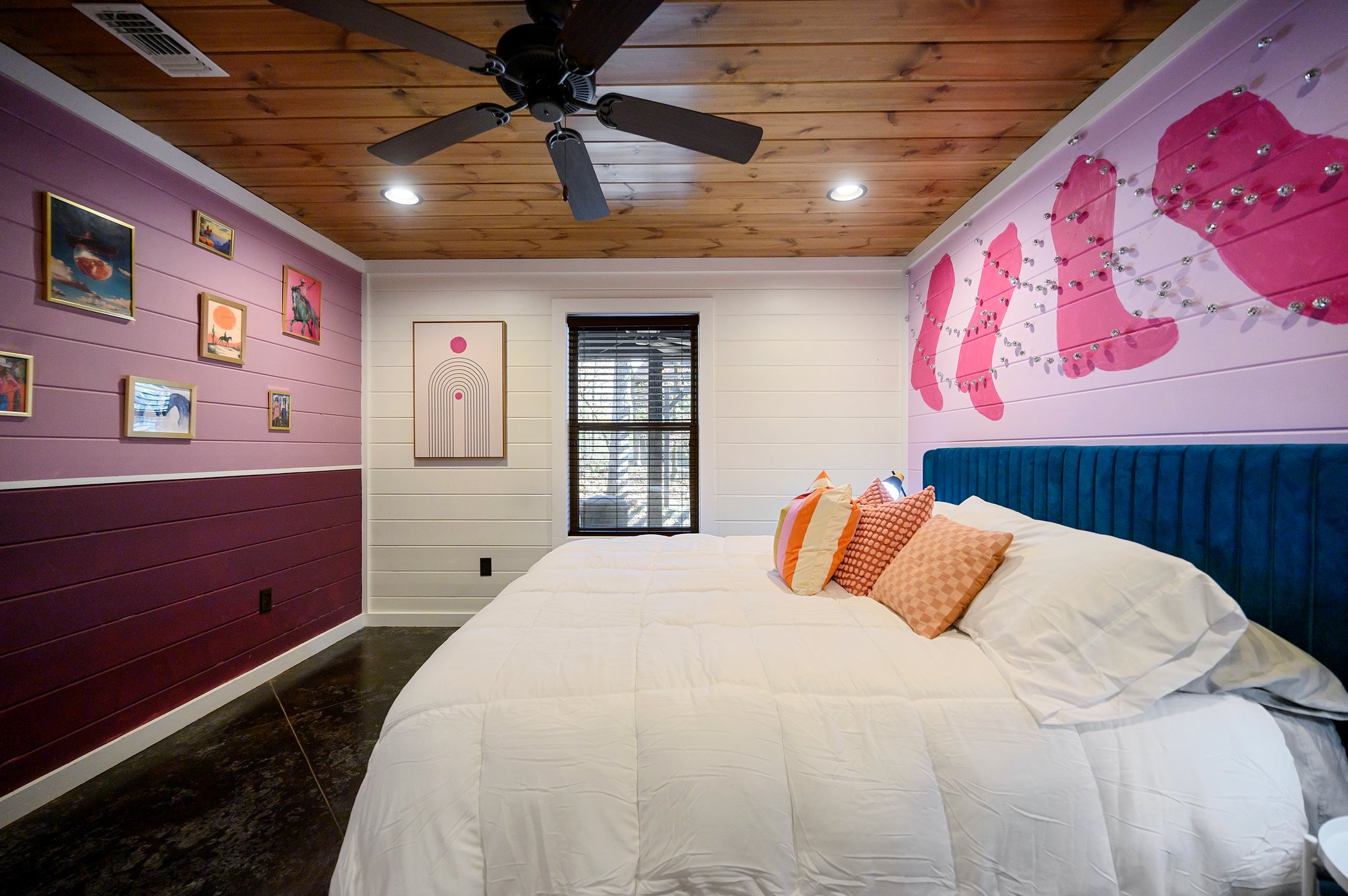 A unique blend of cowboy charm and playful flair with a cowboy boots art wall, disco ball decor strings, and framed artwork for the ultimate cozy retreat.