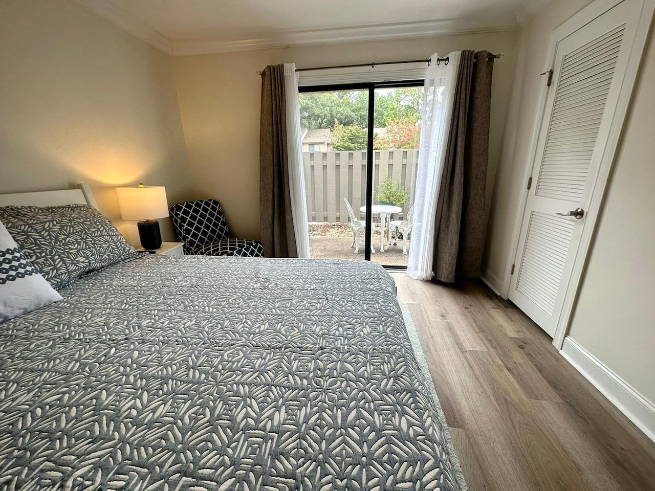Bedroom with doors to the patio