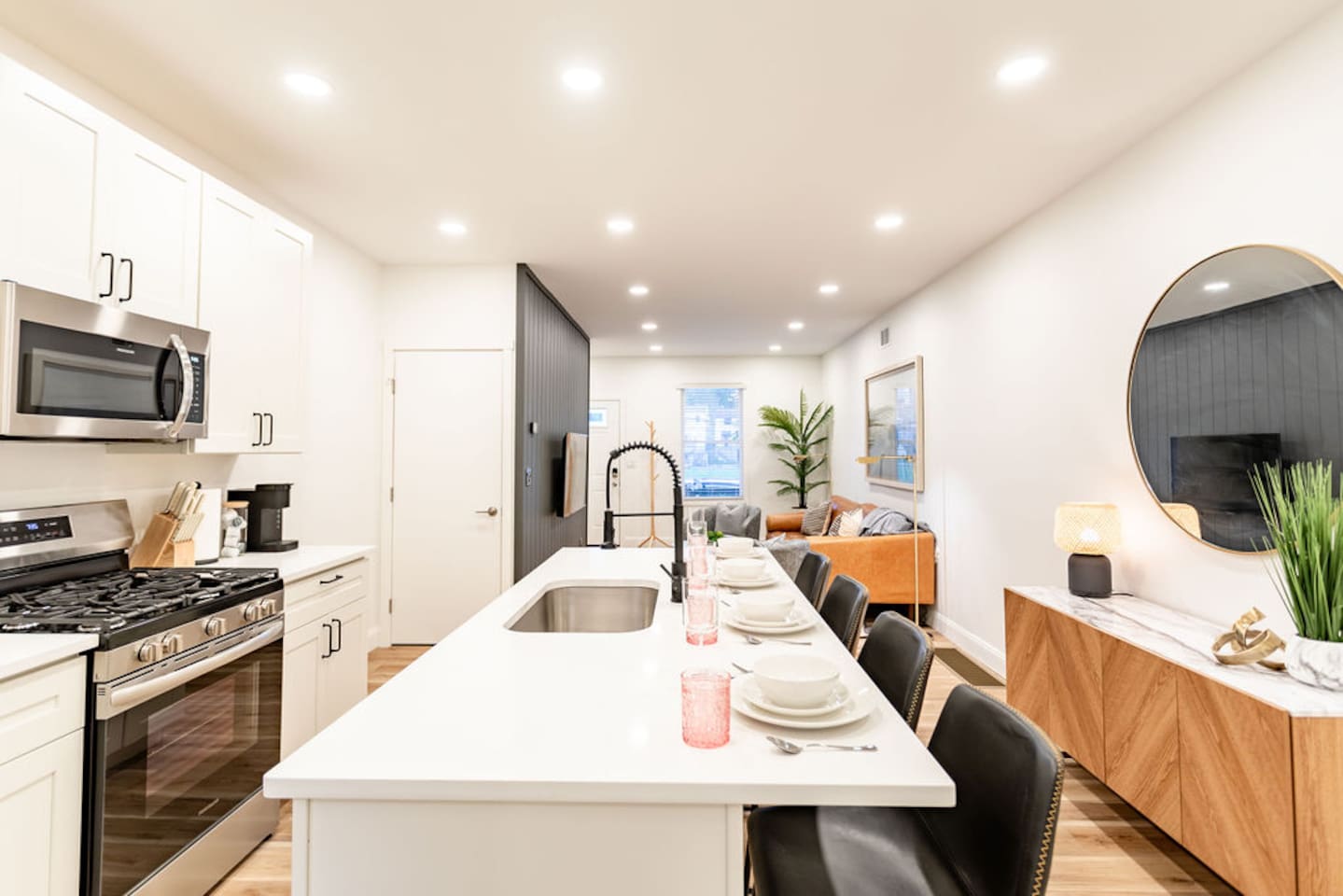 Full kitchen with counter dining and a sink, offering everything you need for cooking and enjoying meals.