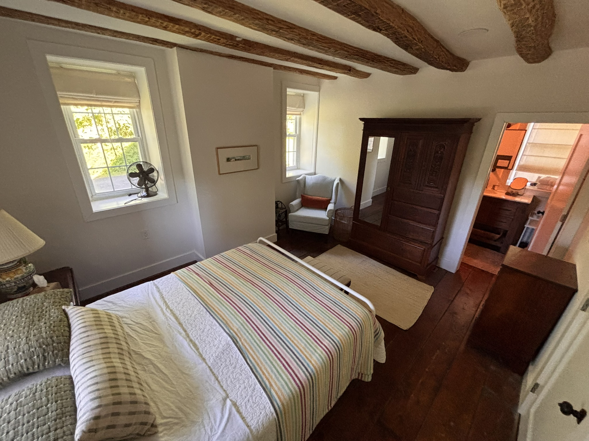 1st floor primary bedroom w queen bed and en suite full bathroom w walk-in shower