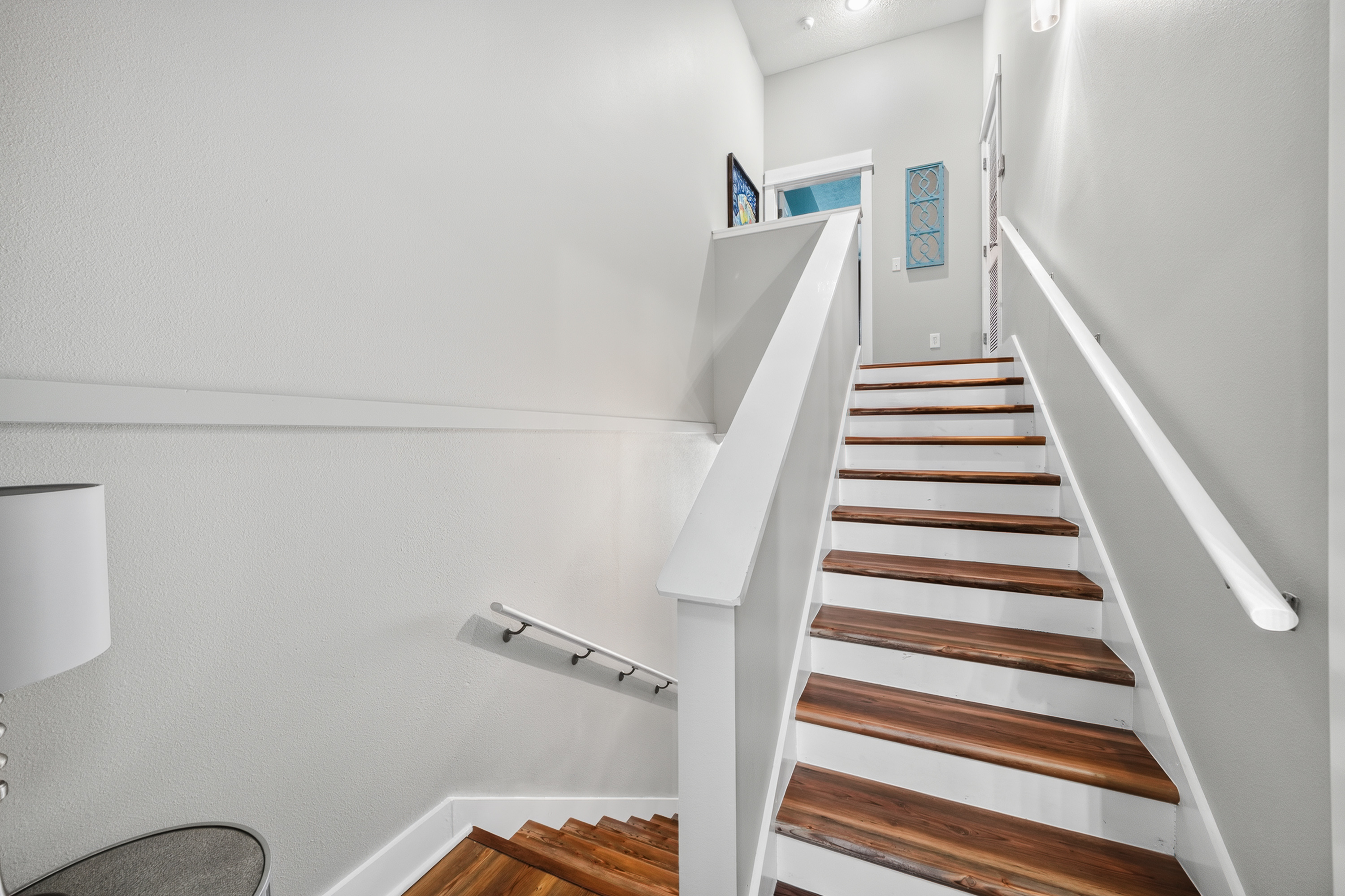This beautiful staircase leads to the Bedrooms, creating the perfect space for relaxing