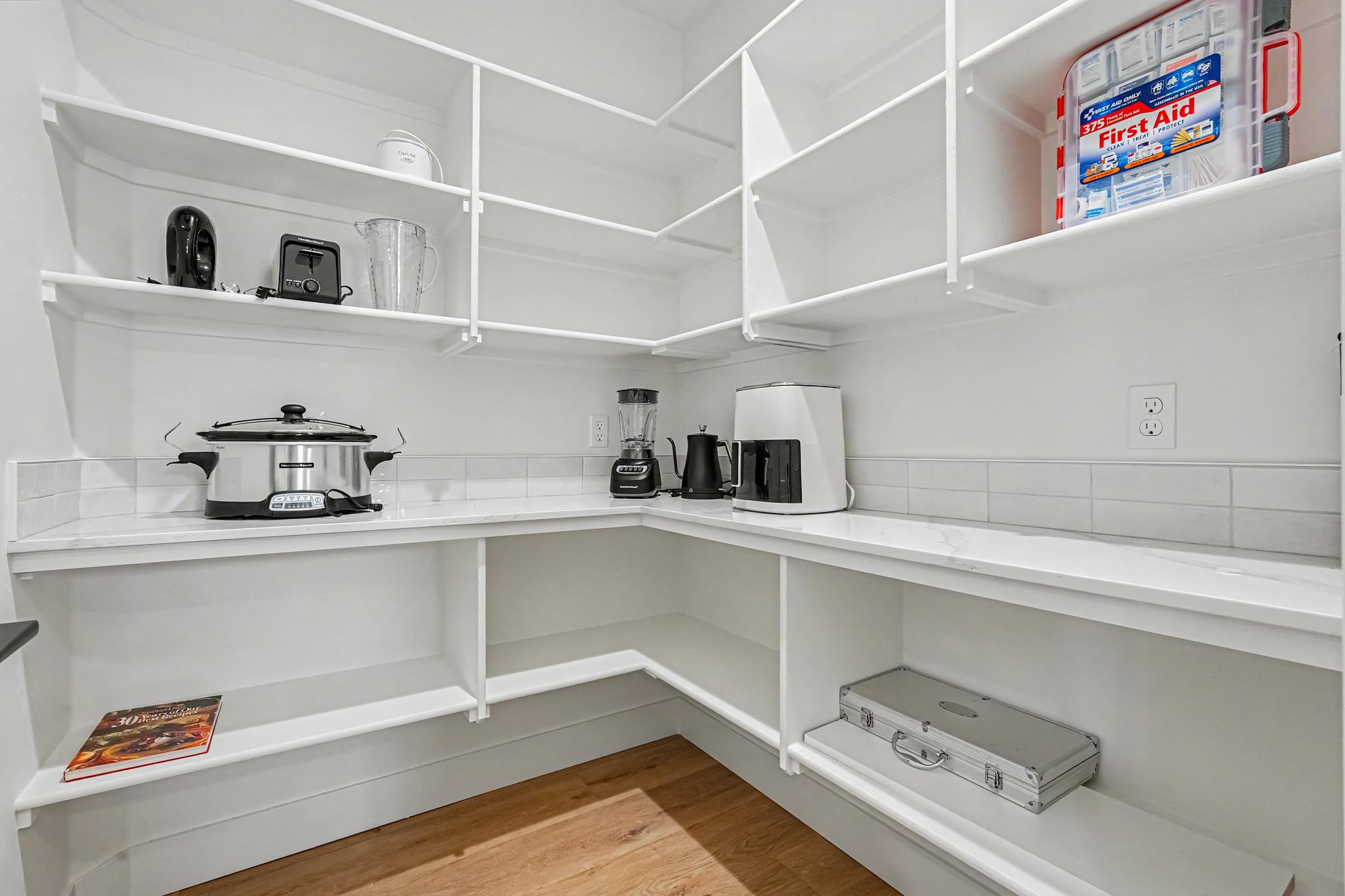 Enjoy the convenience of a large pantry just off the kitchen, providing ample room for groceries, small appliances, and kitchen essentials.
