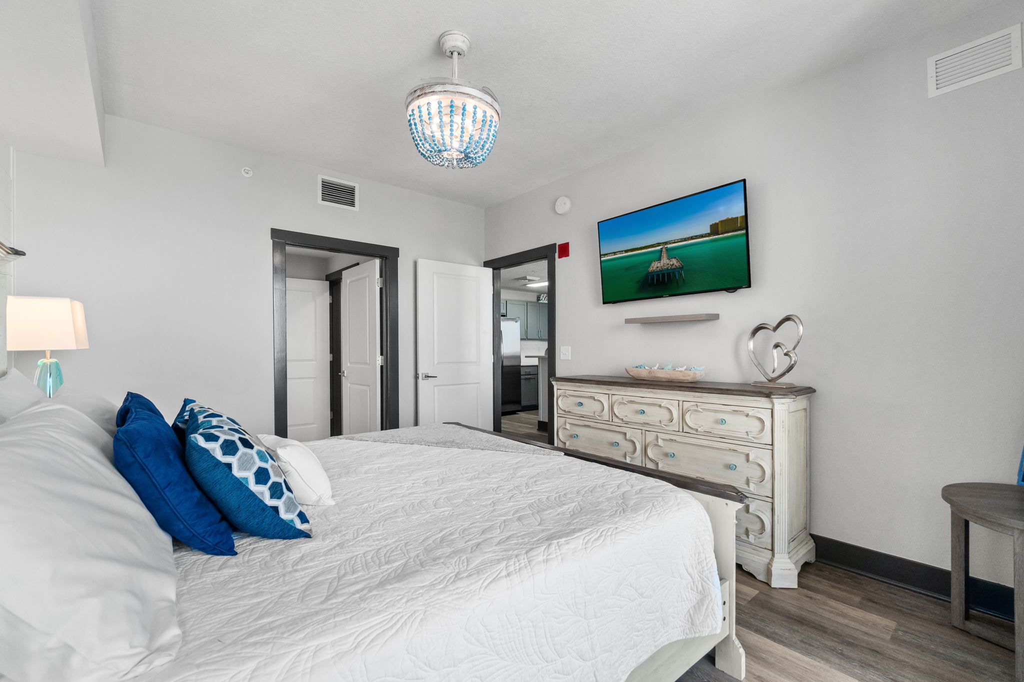 Primary bedroom with King bed, smart TV and fandal