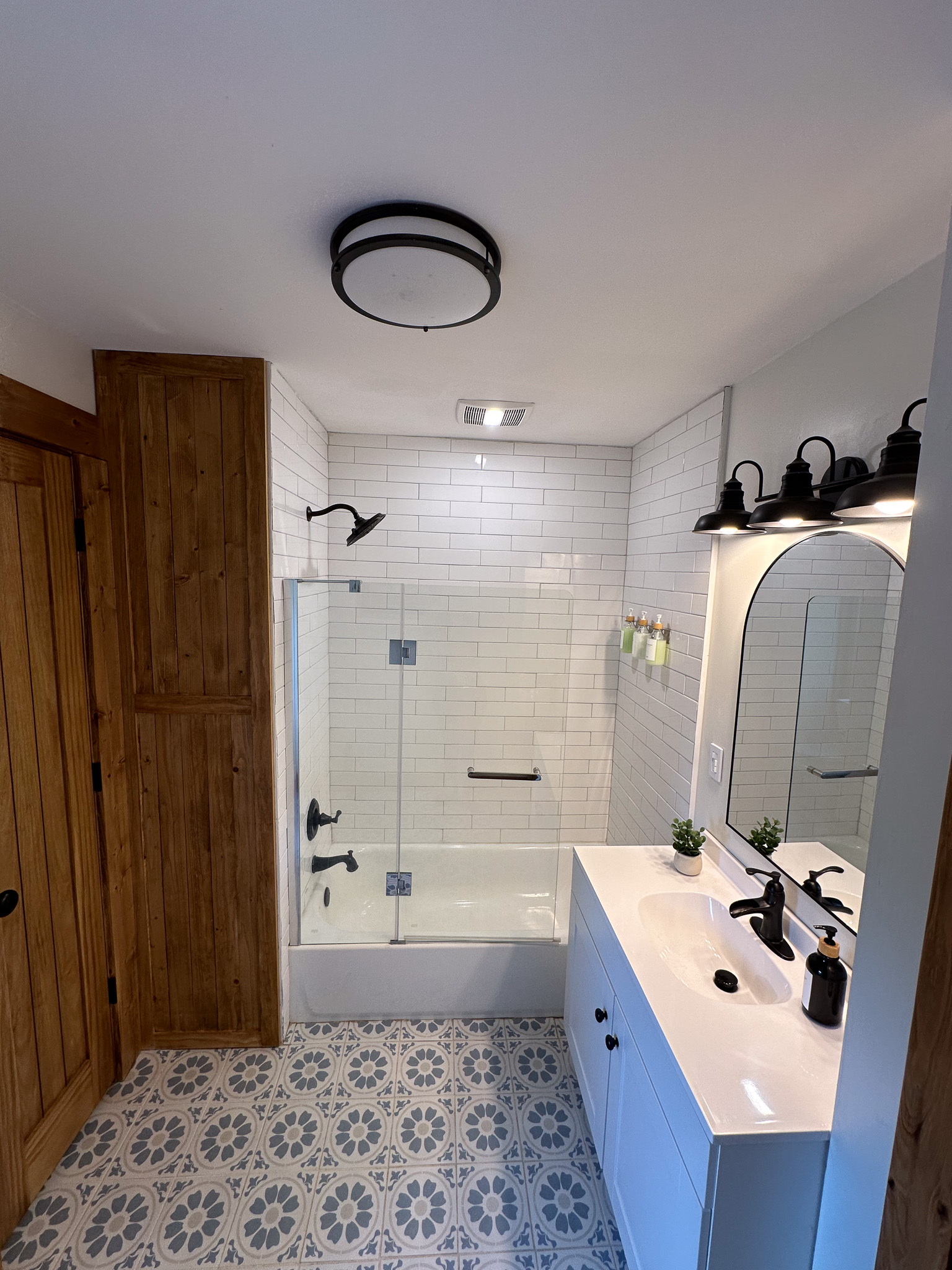 Upstairs hall bathroom with tub and shower