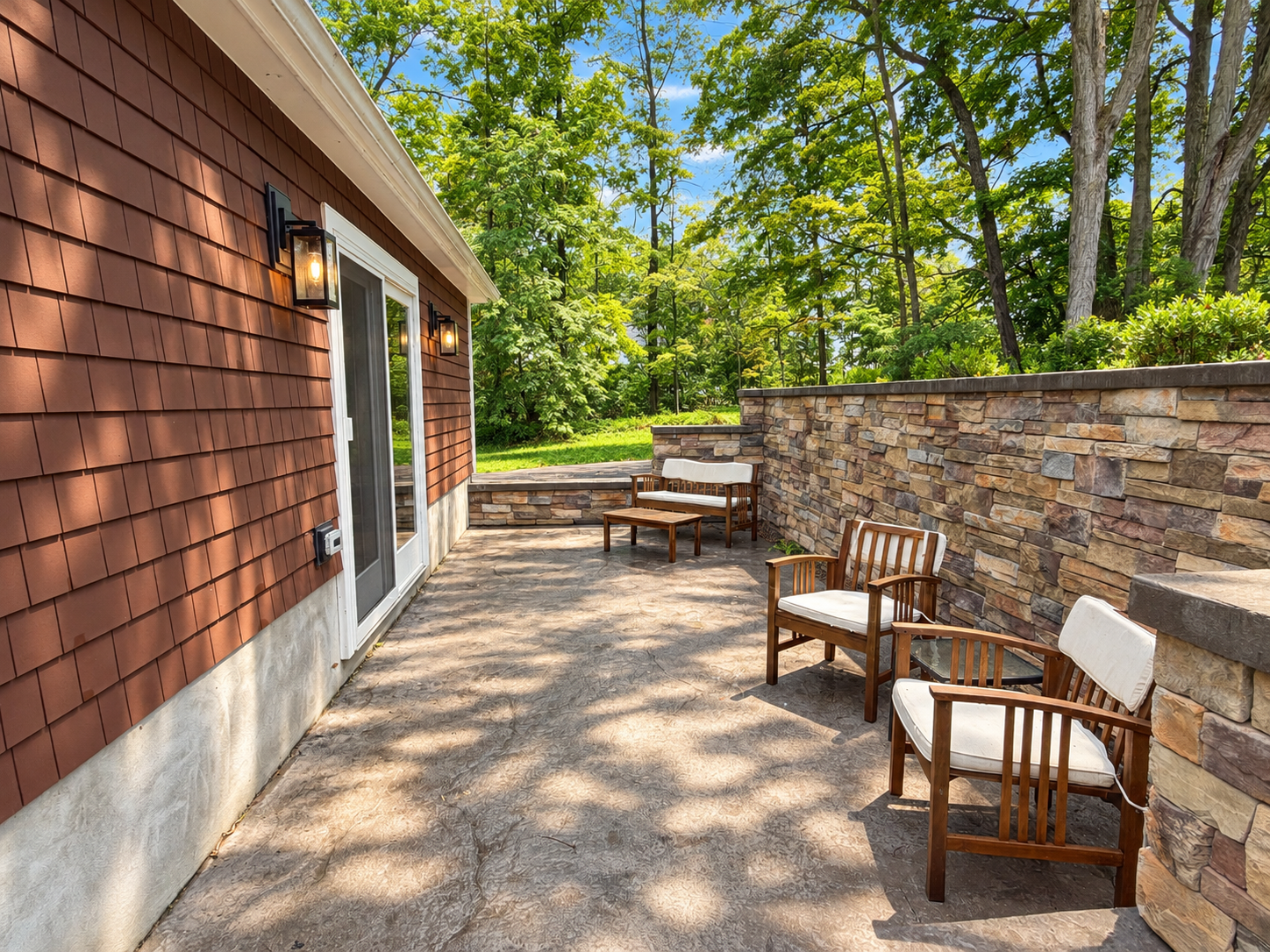 Back patio with seating area, accessible via the mudroom.
