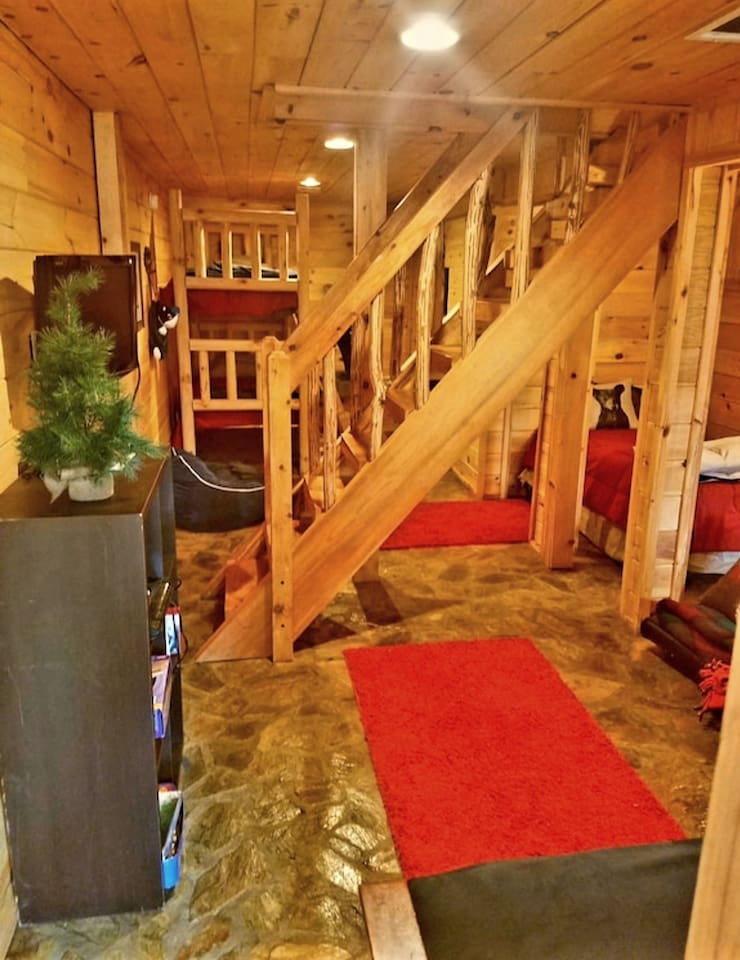 lower level with bunk beds, twin bed and queen futon bed.