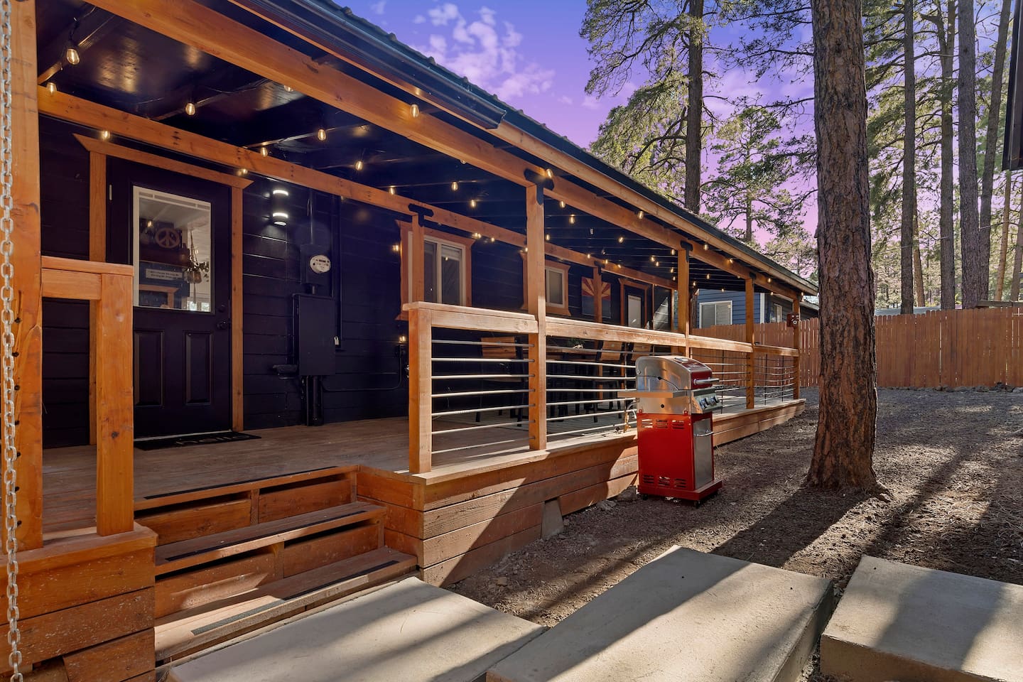 The rear porch extends the entire length of the cabin.