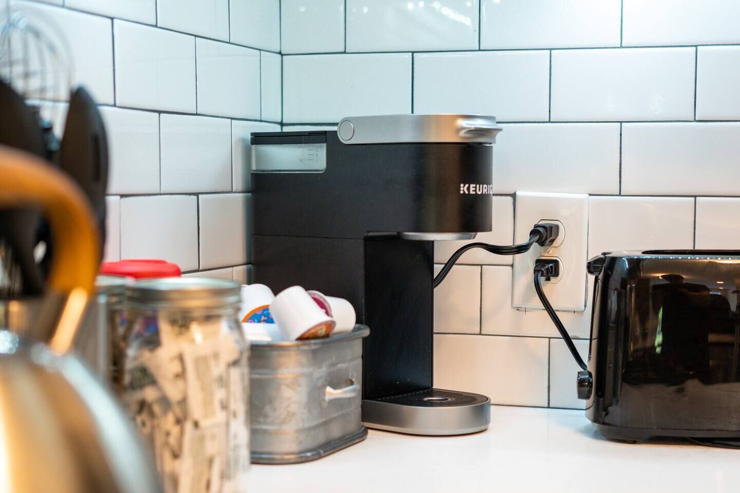 Keurig coffee maker, coffee, creamer, & sugar in each unit
