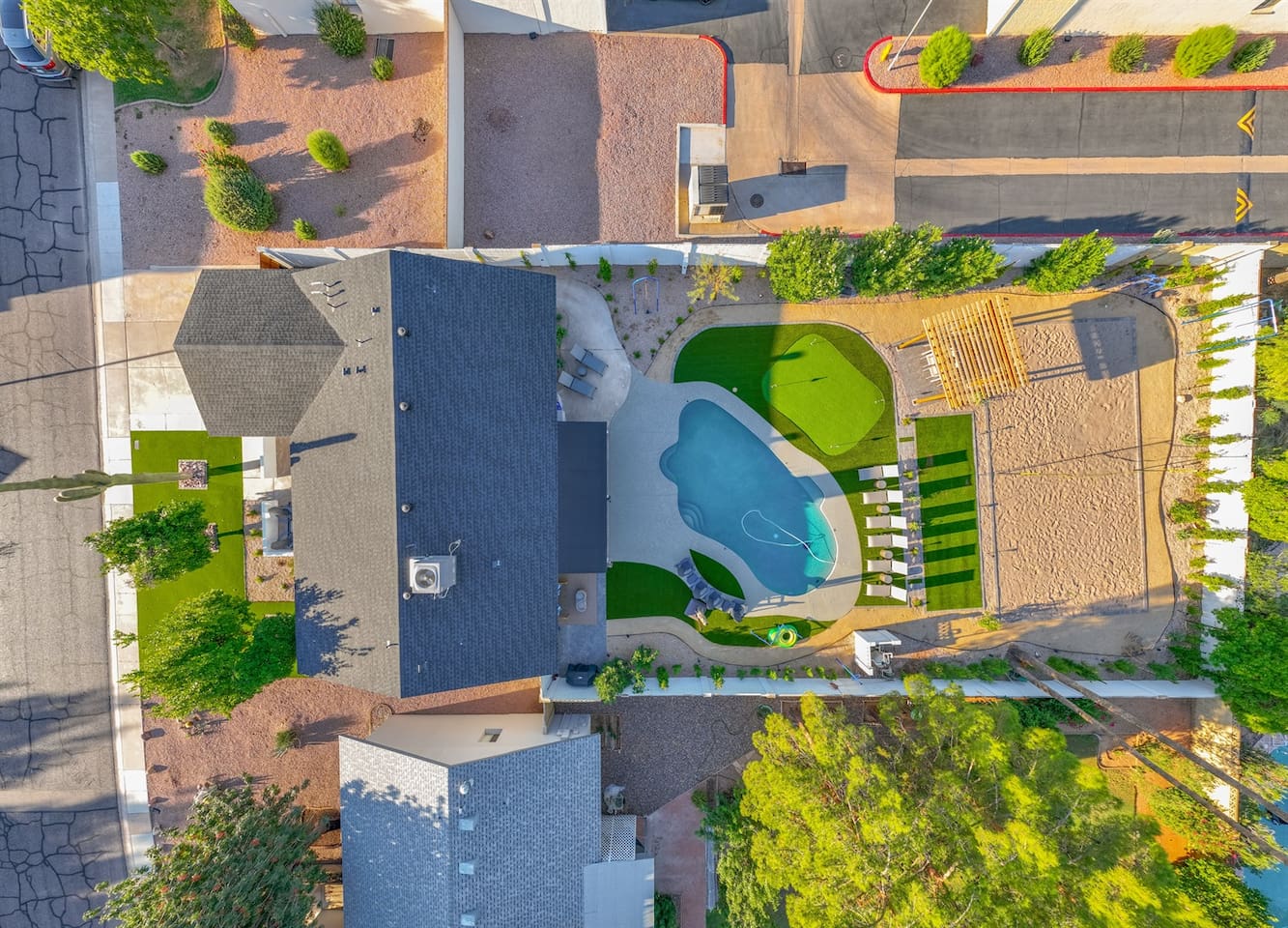 See the stunning exterior of the house, showcasing its unique architecture and beautifully landscaped surroundings for a warm and inviting atmosphere.