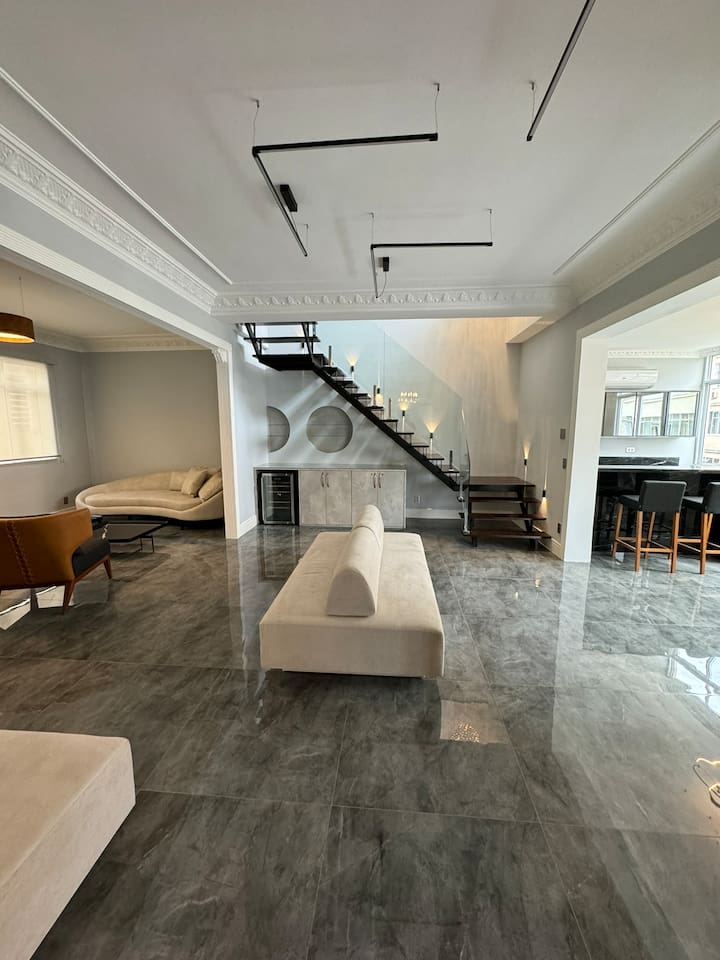 Ultra high ceilings in this modern renovation of a historic penthouse!
