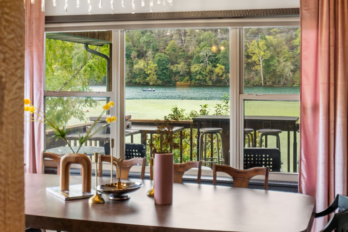 Elegant dining for 12-14 people with lake view.