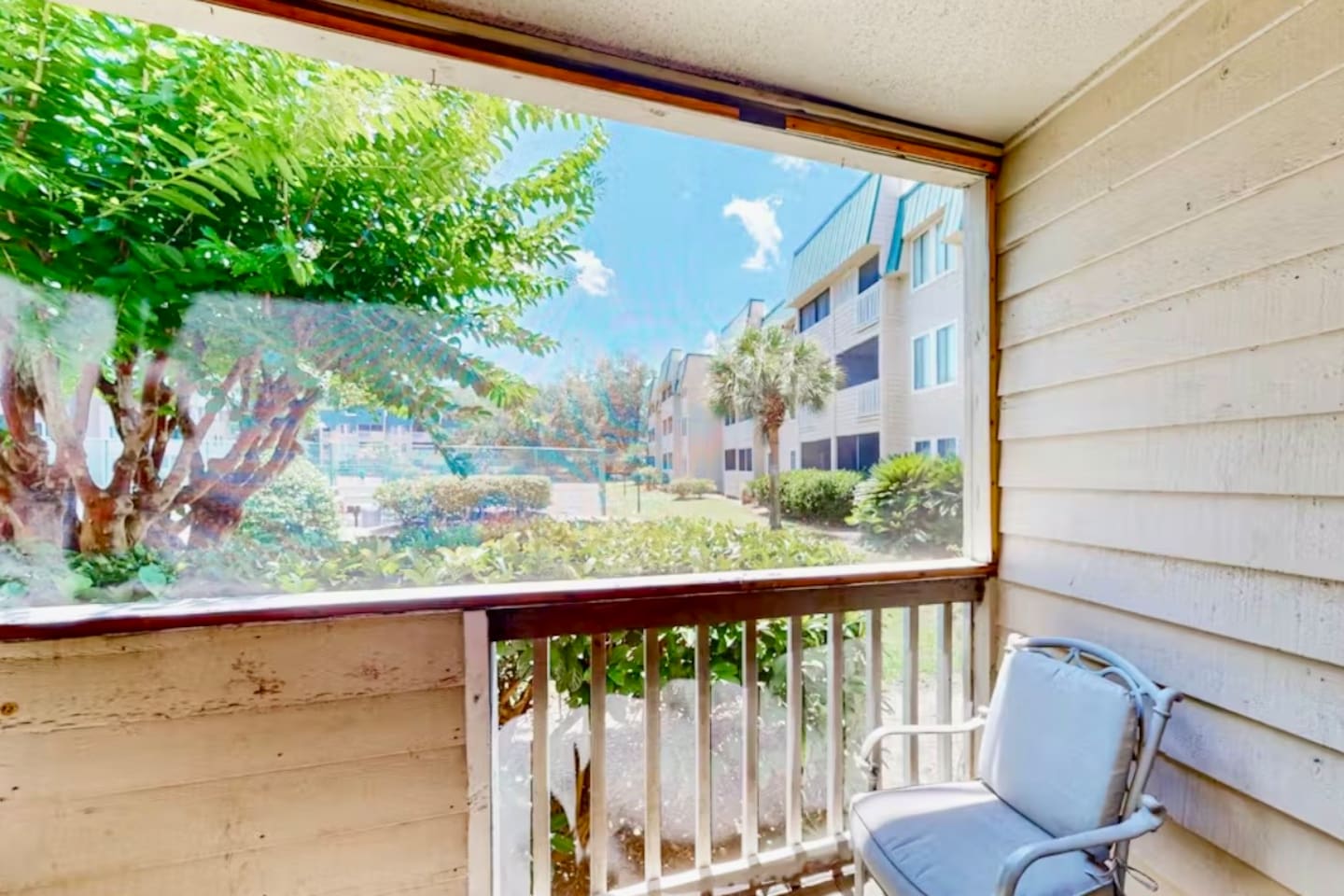 Screened porch with garden view