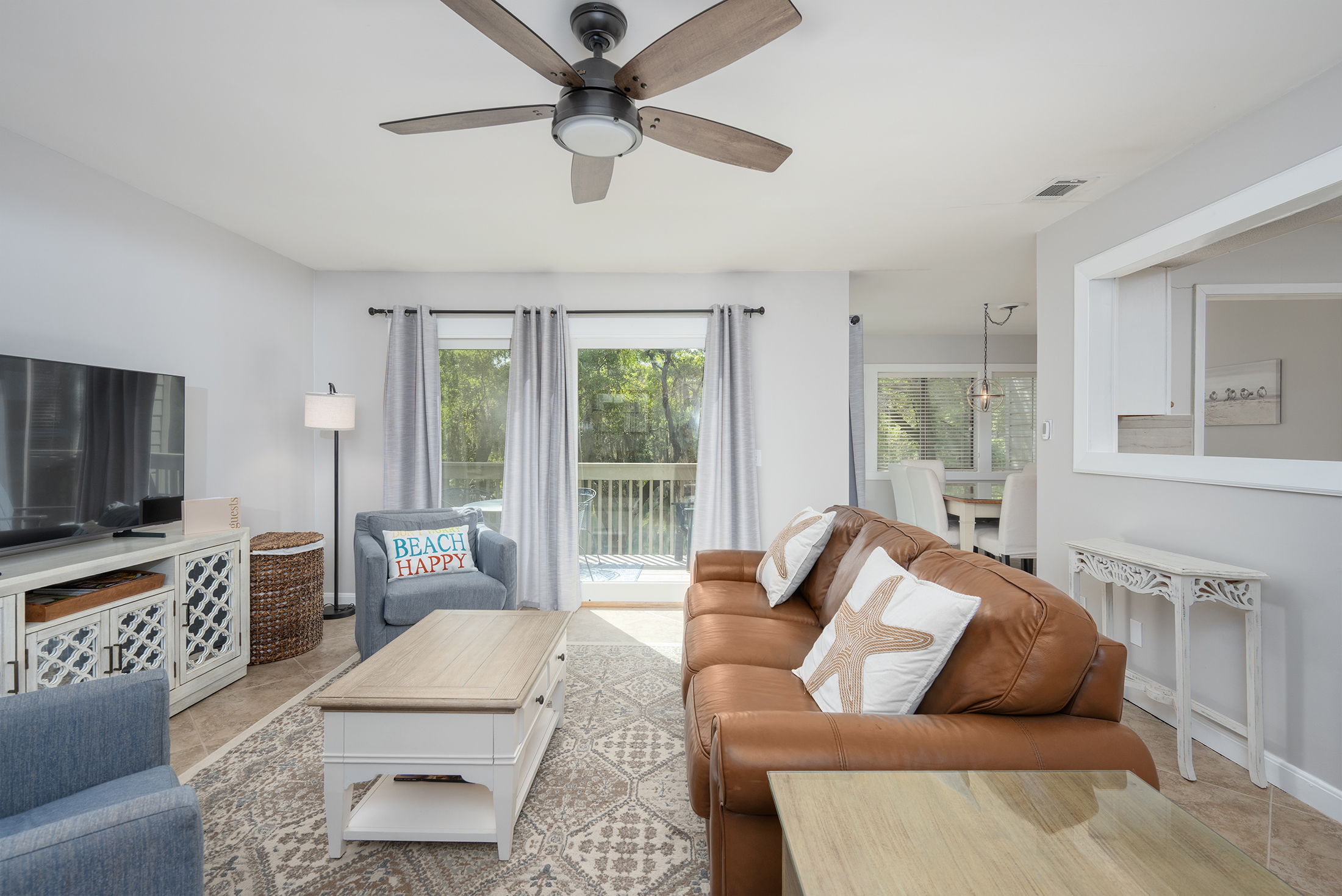 Living room gets plenty of natural light and features a great view to the porch