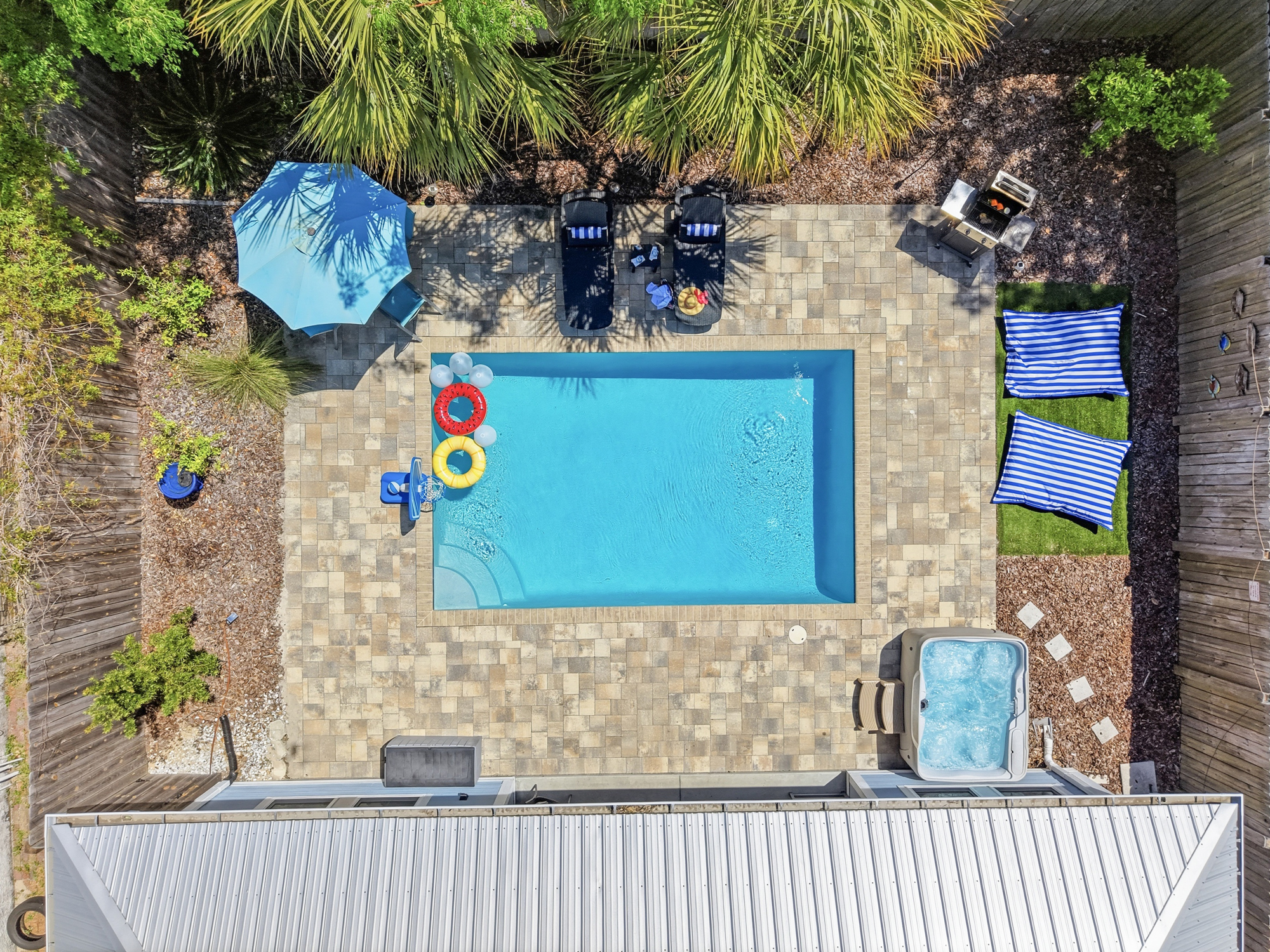 Relax on the pool deck with your favorite beverage, and watch friends and family play the day away in the pool with floats, basketball, masks and more, or simply hang in the hot tub and soak for the evening.