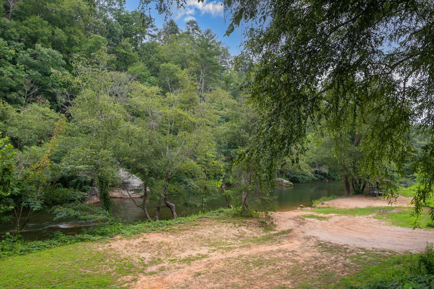 Old Swimming Hole. 
Located when you enter the main gate to the right. You will see the sign, drive down and enjoy the river!