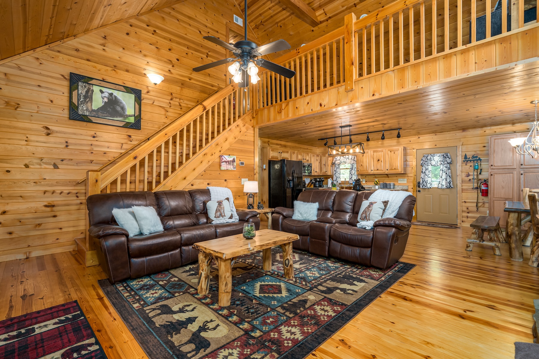 Walk a few stairs from the living room up to the loft area and find a plush sofa, games and another TV. 