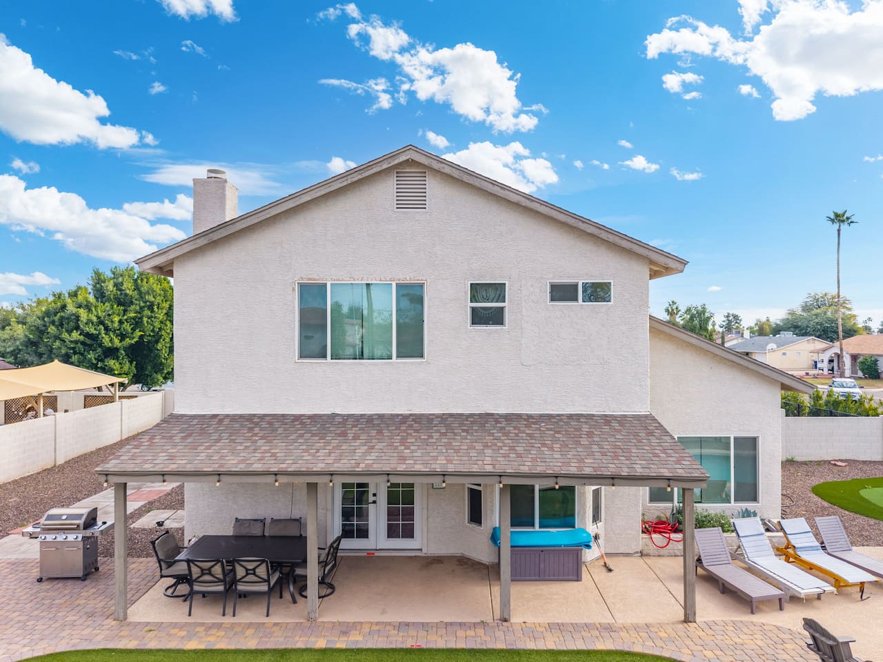 Grill, lounge, and soak it all in — this backyard has every angle covered.