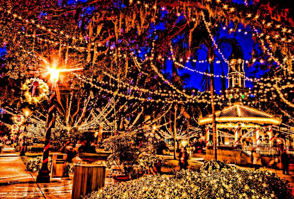 - Vibrant holiday lights nearby - Festive glow filling the night - Magical seasonal atmosphere