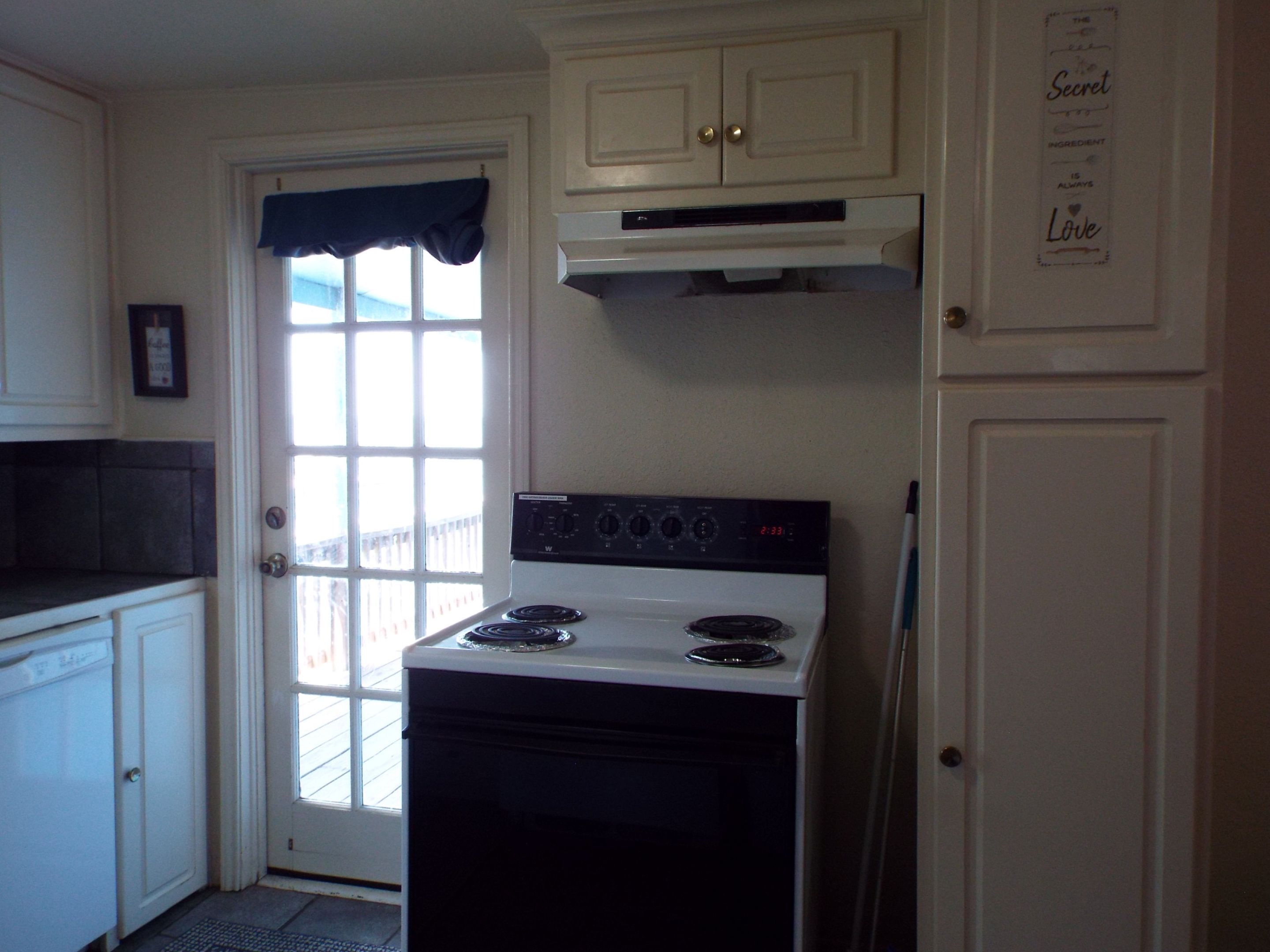 Kitchen with back door to deck