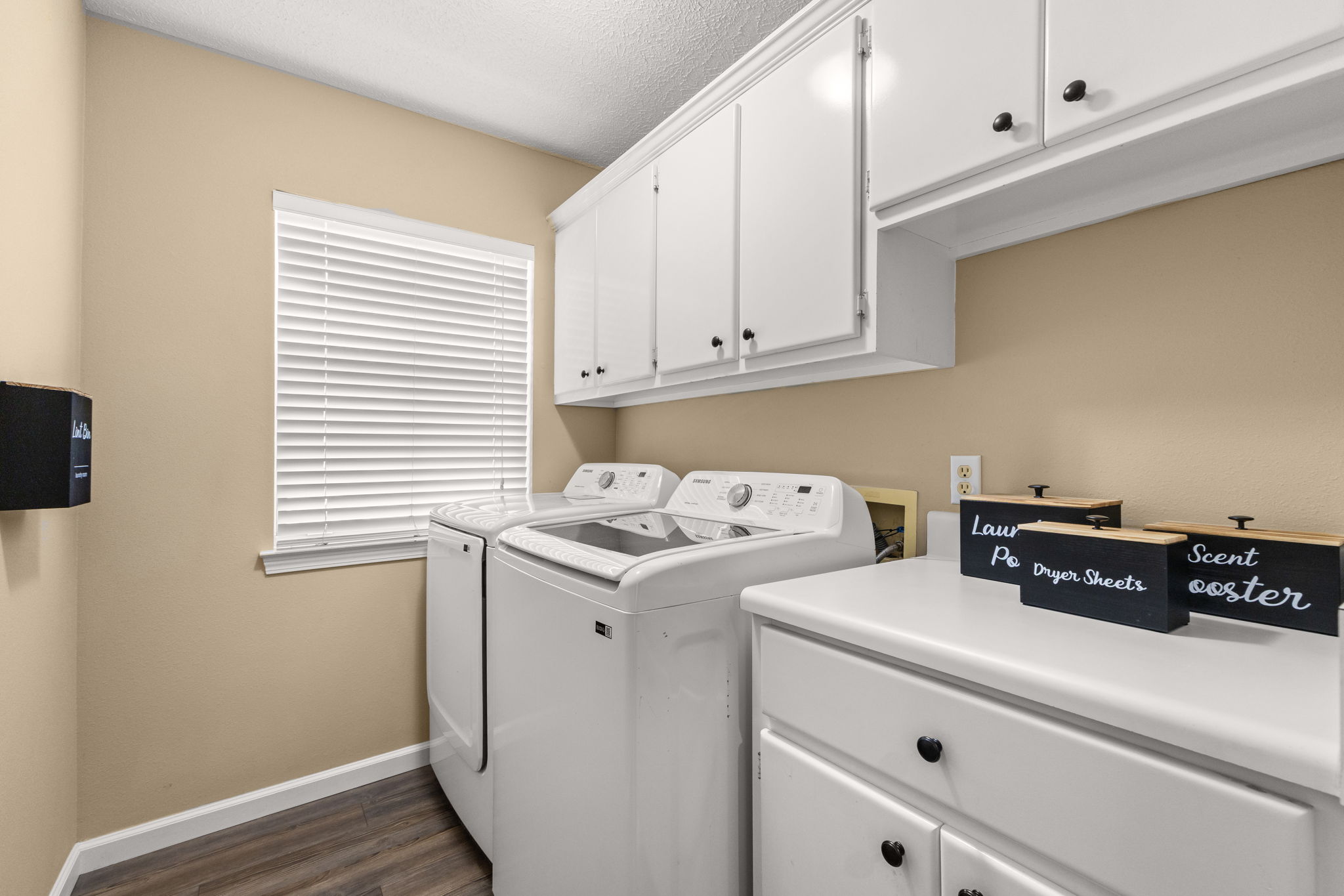 Fully stocked laundry & utility area! Features a full-size washer and dryer complete with complimentary detergent, dryer sheets, and scent boosters. For your convenience, you’ll also find a battery-powered vacuum, a broom, and a dustpan for quick touch-ups